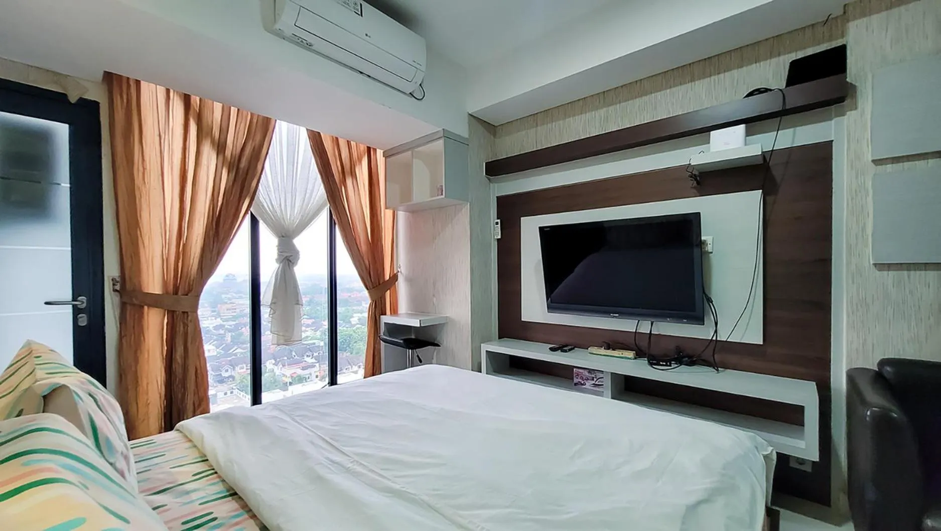 Bed in Palam Mansion at Meisterstadt Pollux Habibie Apartment