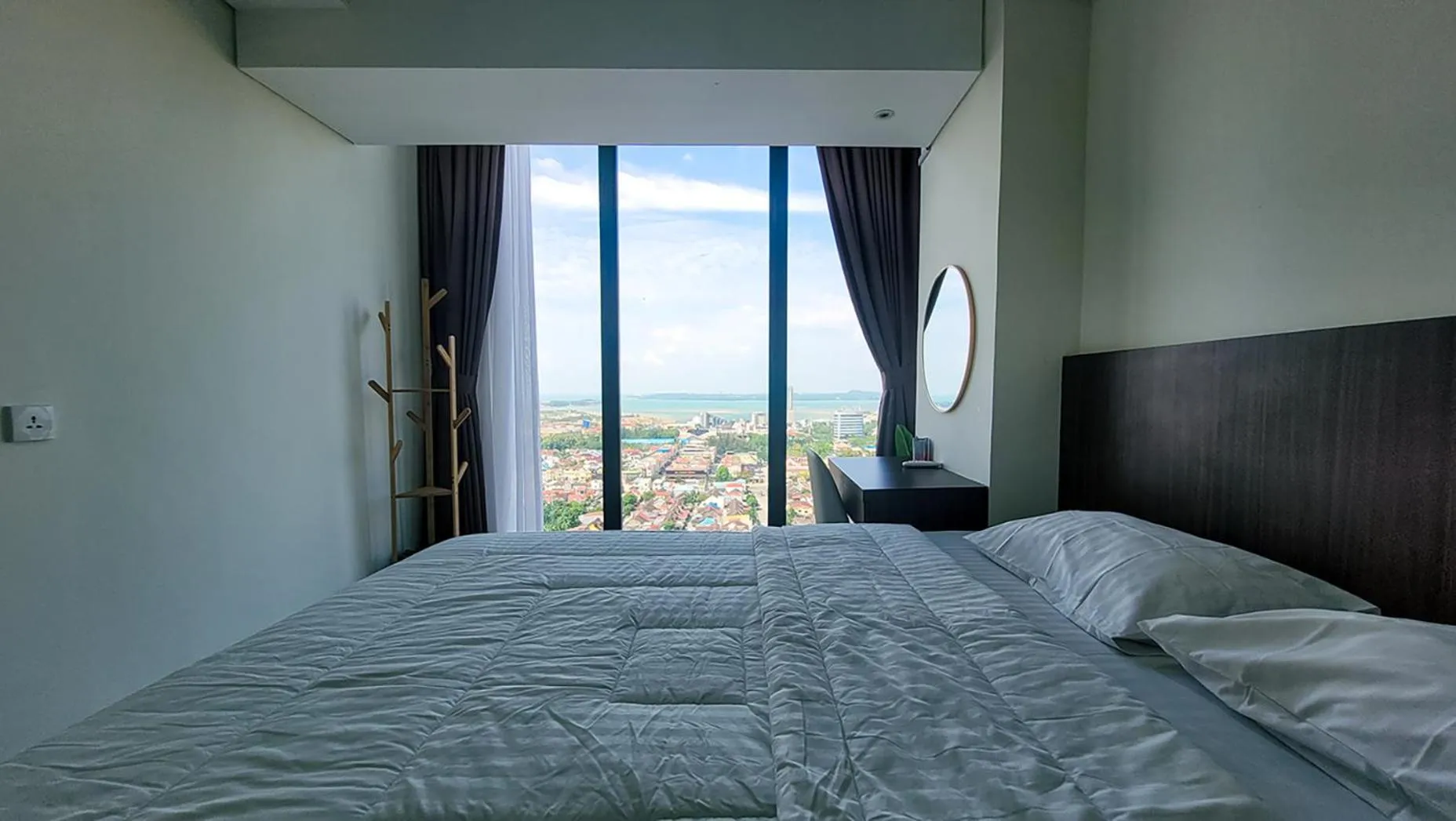 Bed in Palam Mansion at Meisterstadt Pollux Habibie Apartment