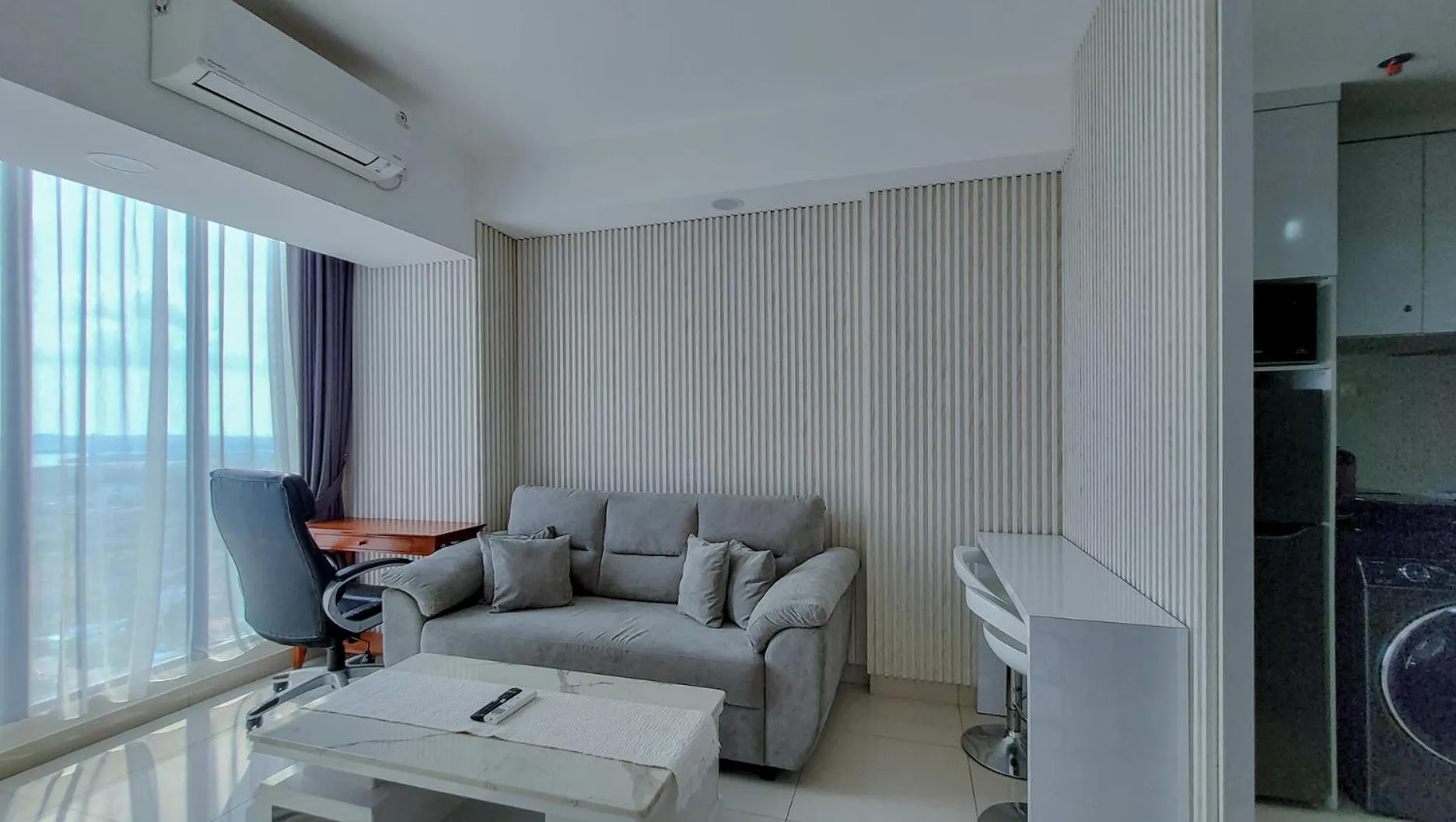 TV and multimedia in Palam Mansion at Meisterstadt Pollux Habibie Apartment