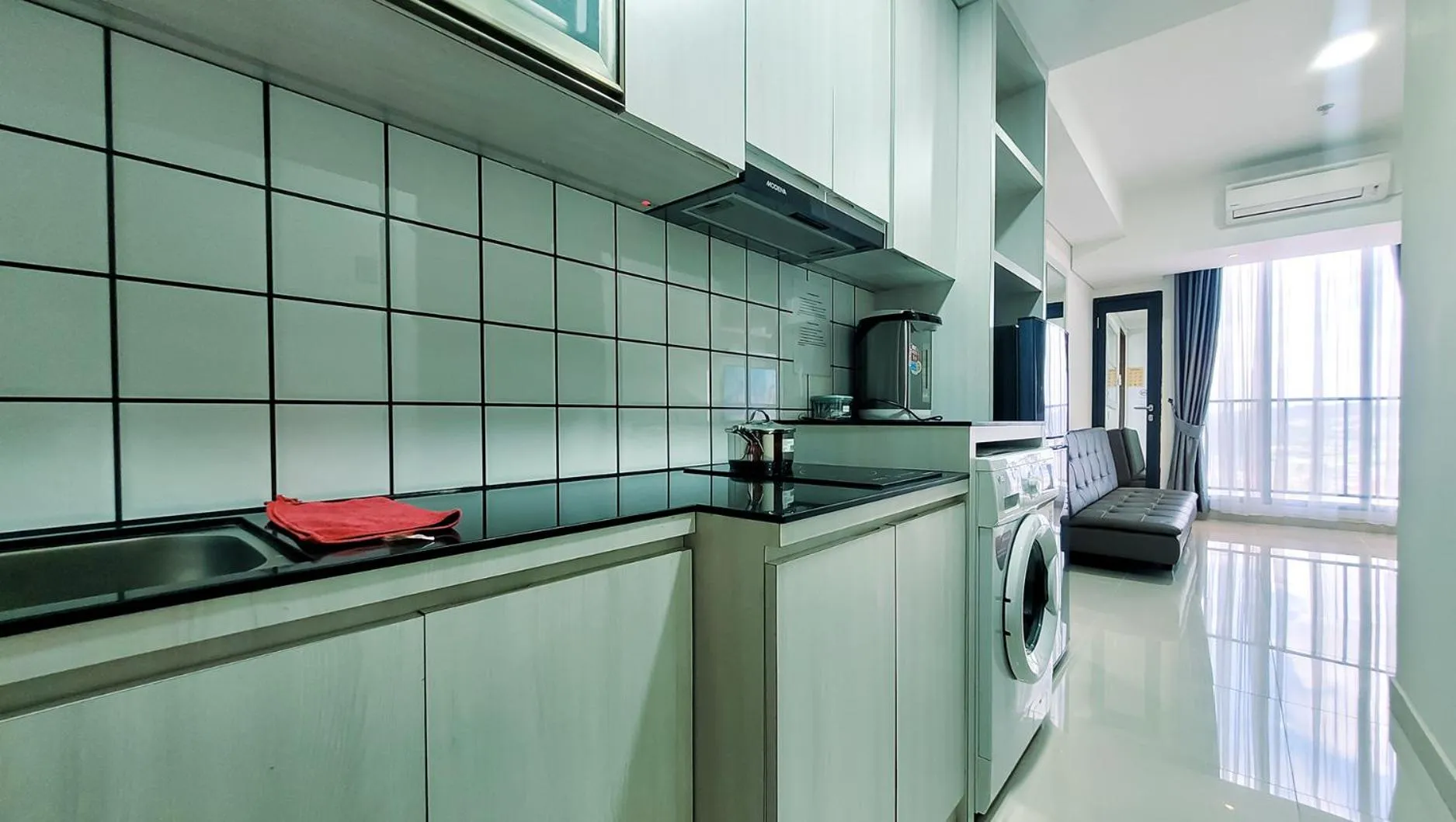 Kitchen or kitchenette in Palam Mansion at Meisterstadt Pollux Habibie Apartment