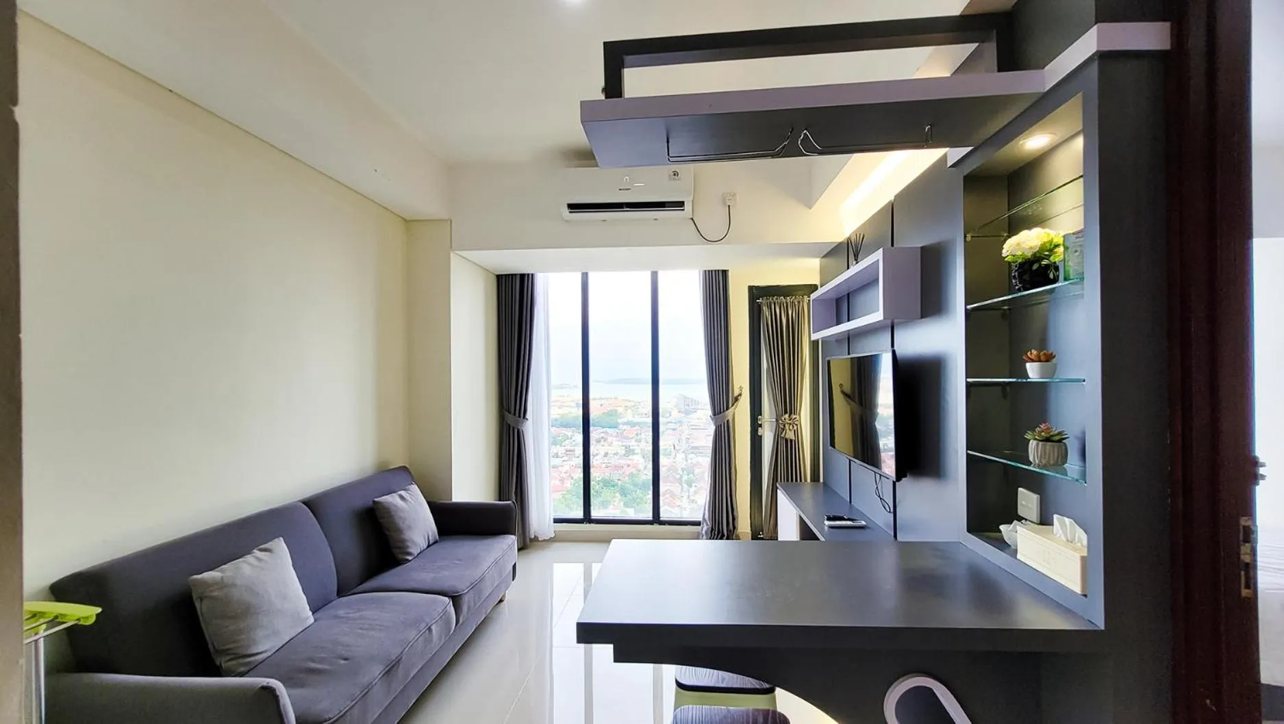 TV and multimedia in Palam Mansion at Meisterstadt Pollux Habibie Apartment