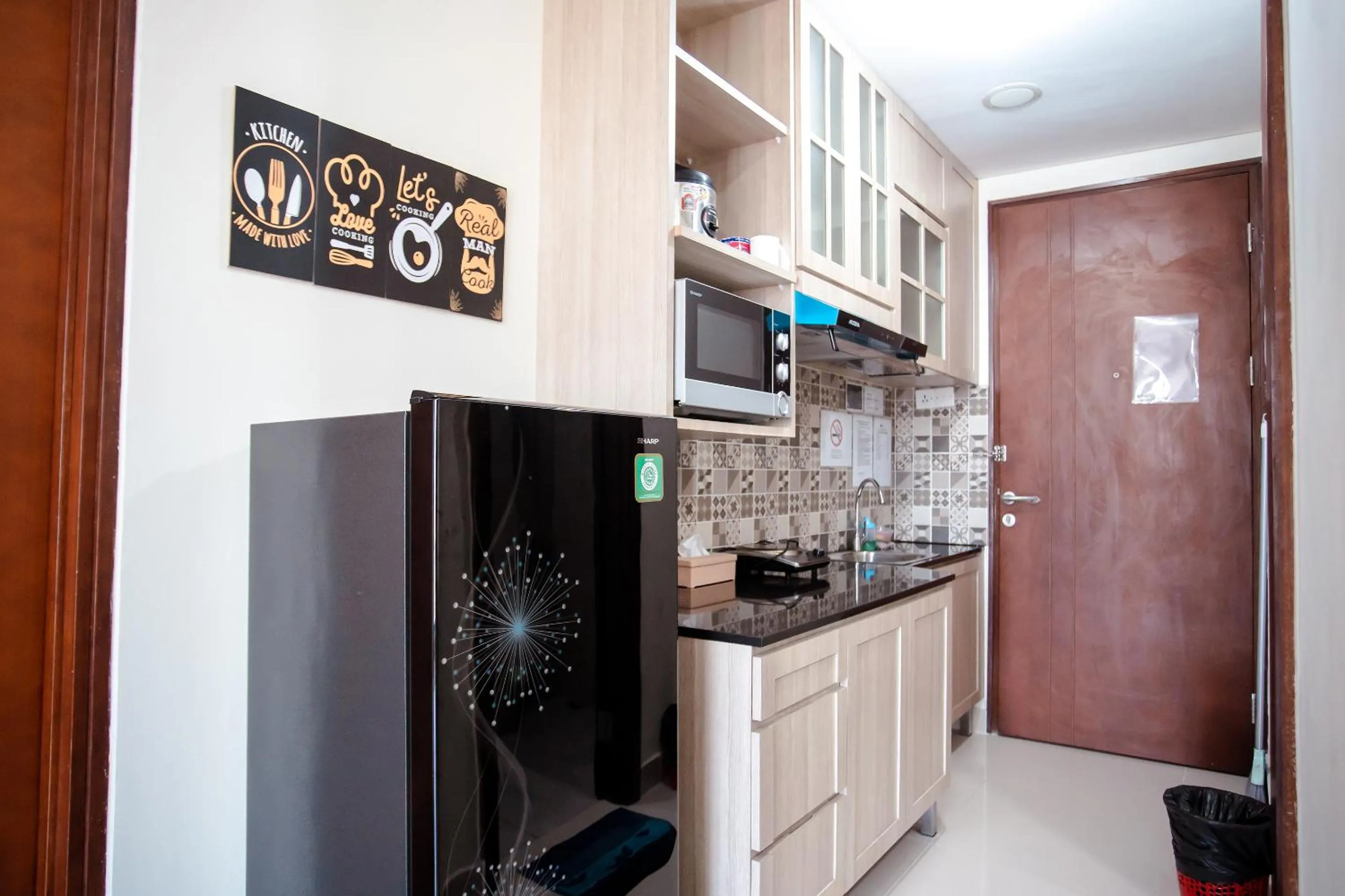 Kitchen or kitchenette in Palam Mansion at Meisterstadt Pollux Habibie Apartment