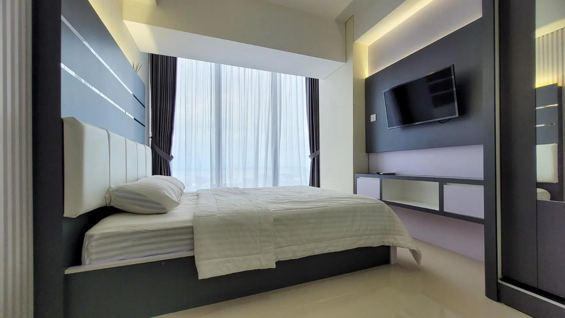 Bed in Palam Mansion at Meisterstadt Pollux Habibie Apartment