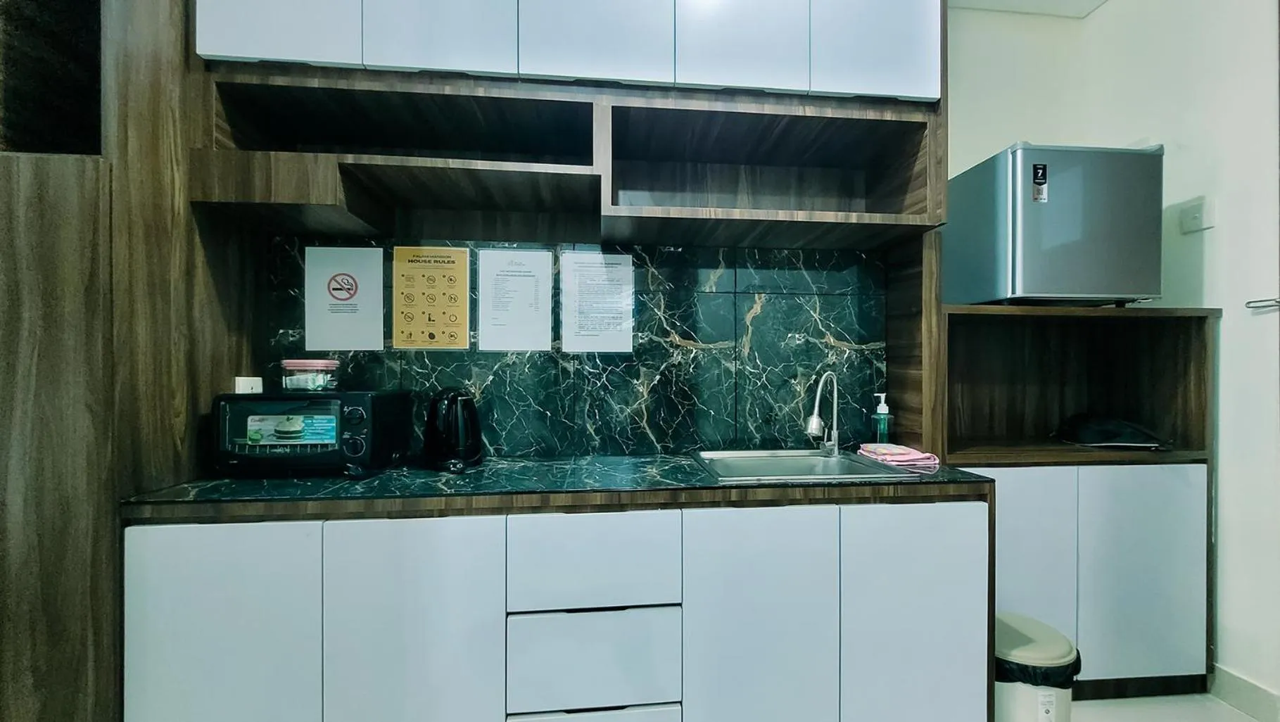 Kitchen or kitchenette in Palam Mansion at Meisterstadt Pollux Habibie Apartment
