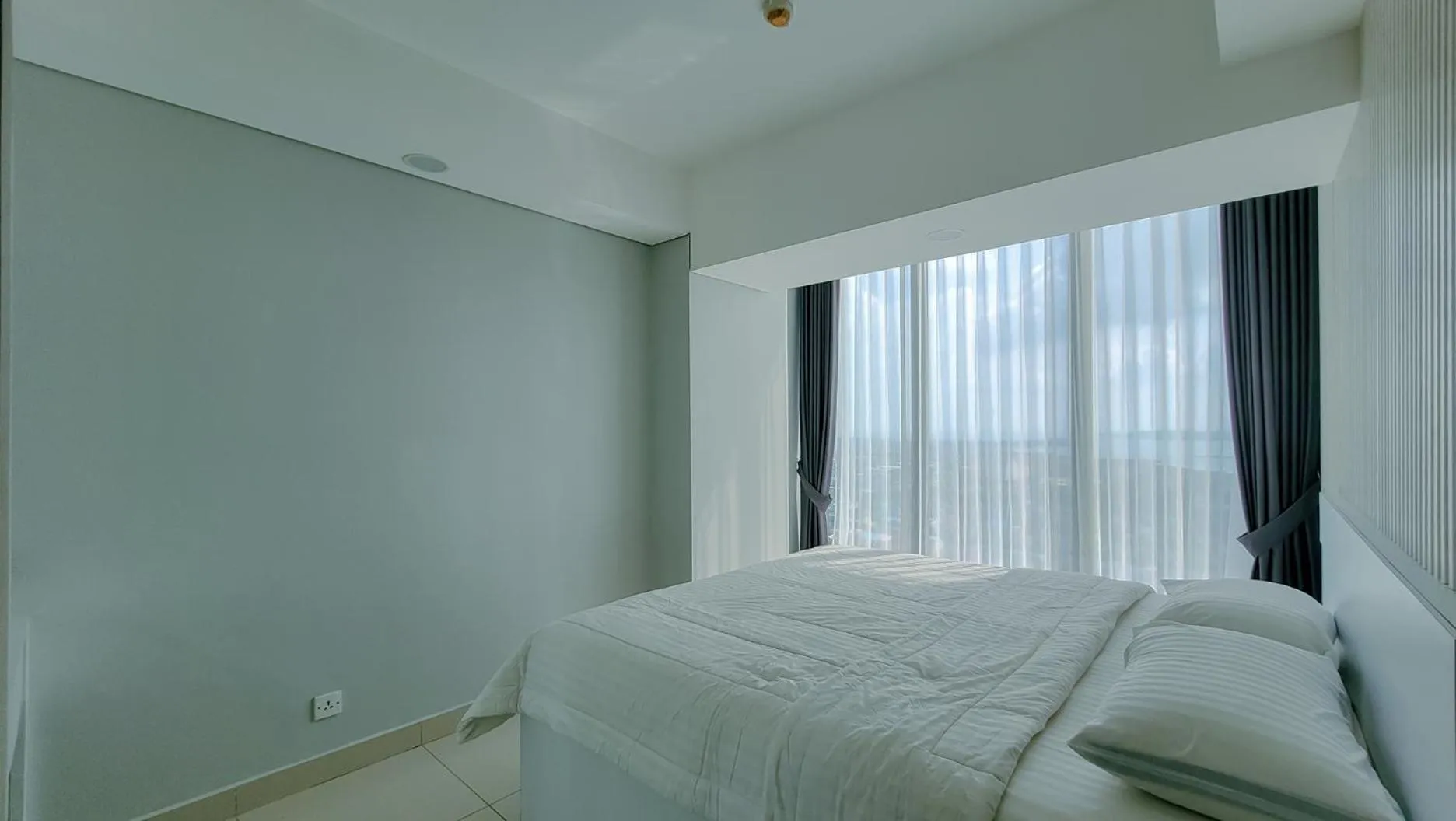 Bed in Palam Mansion at Meisterstadt Pollux Habibie Apartment