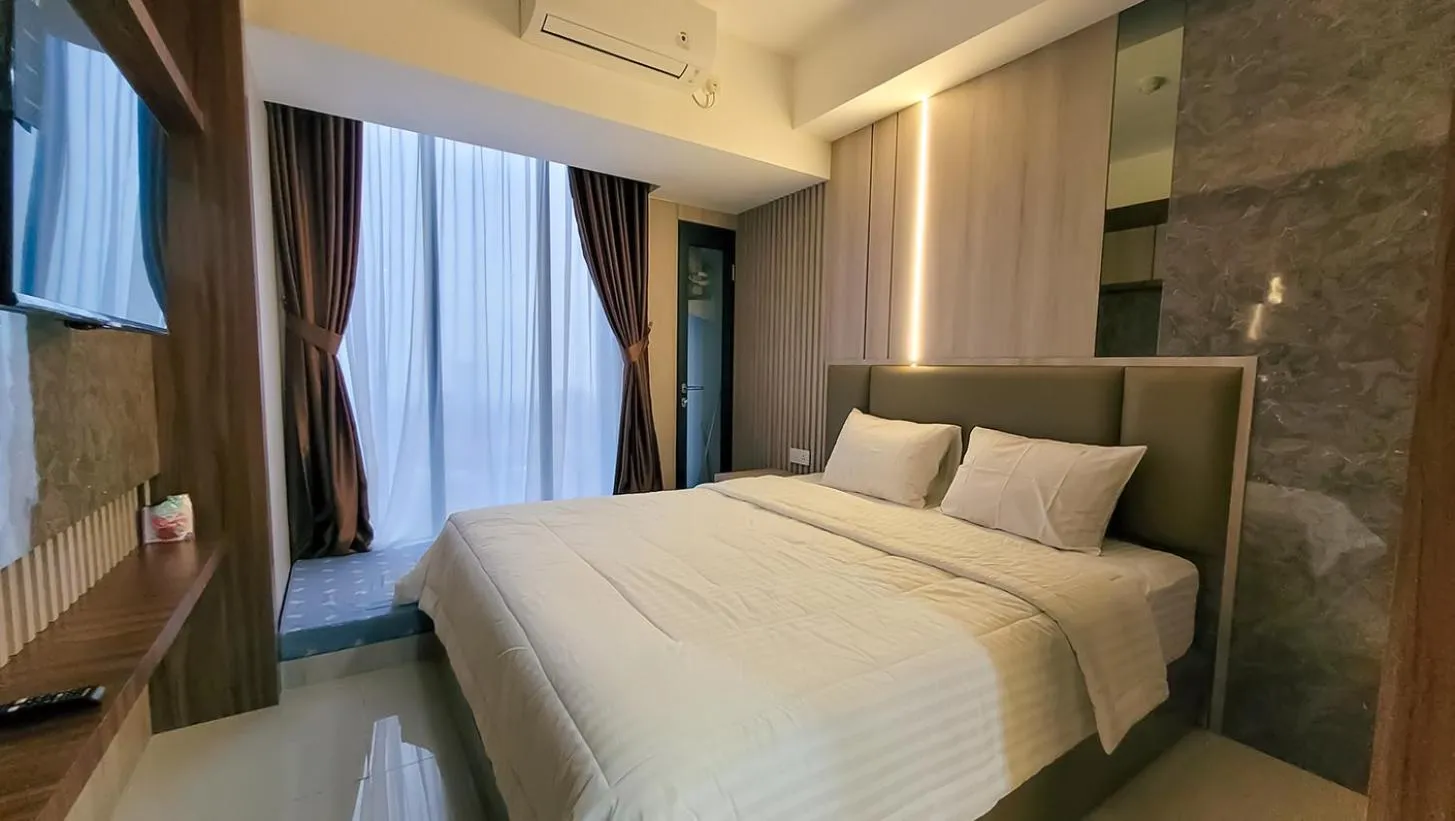 Bed in Palam Mansion at Meisterstadt Pollux Habibie Apartment