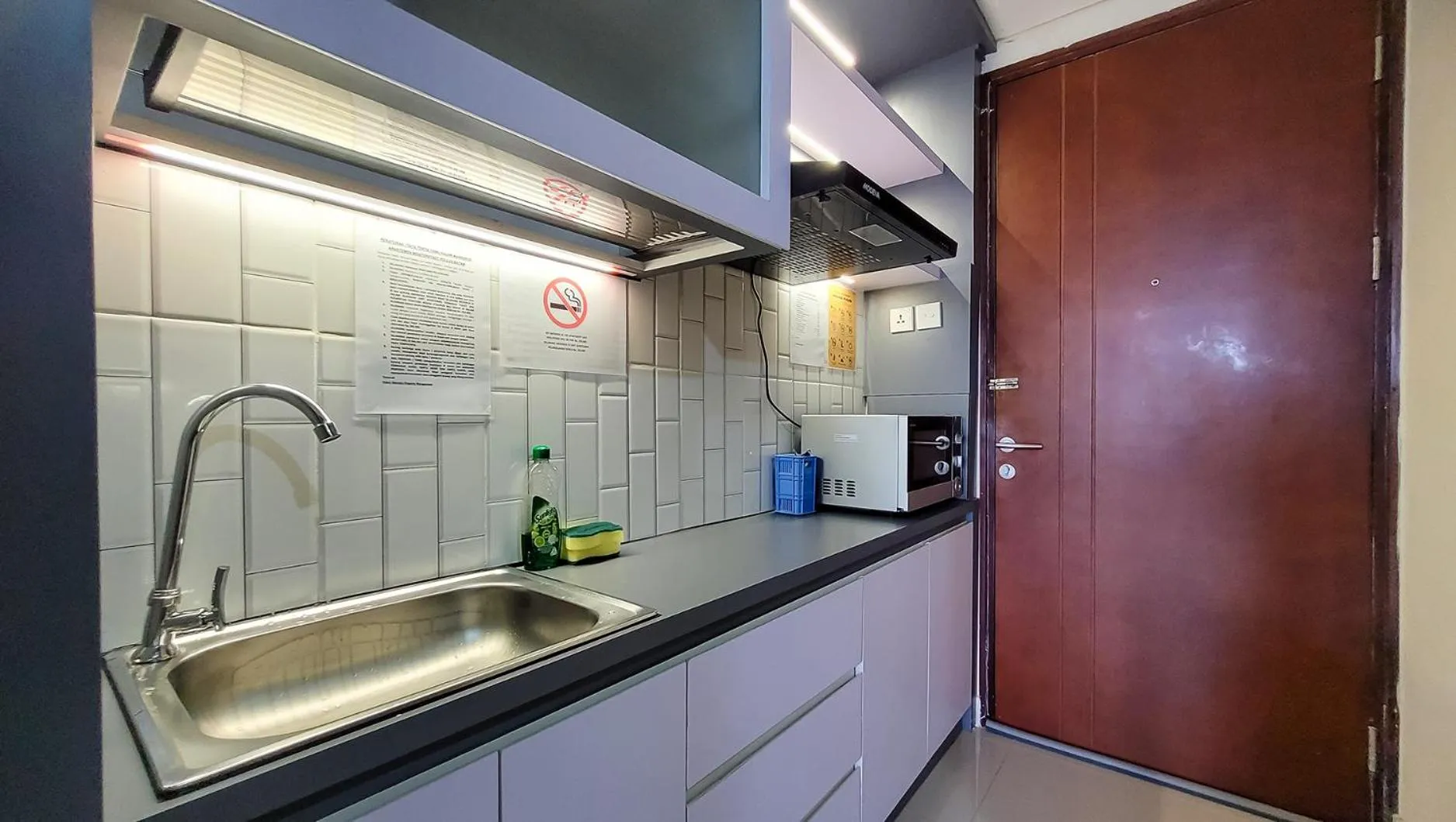 Kitchen or kitchenette in Palam Mansion at Meisterstadt Pollux Habibie Apartment