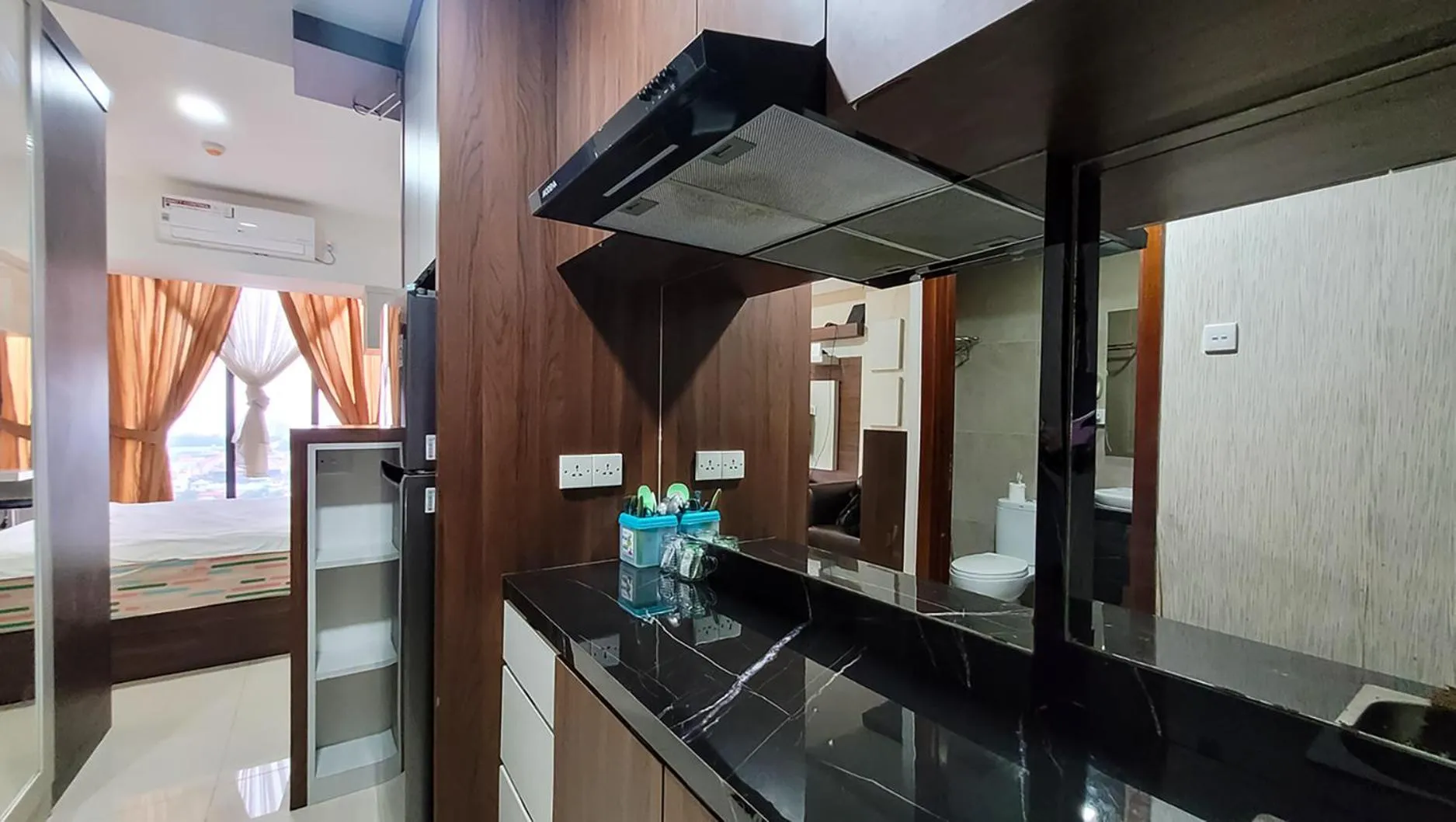 Kitchen or kitchenette, Bed in Palam Mansion at Meisterstadt Pollux Habibie Apartment