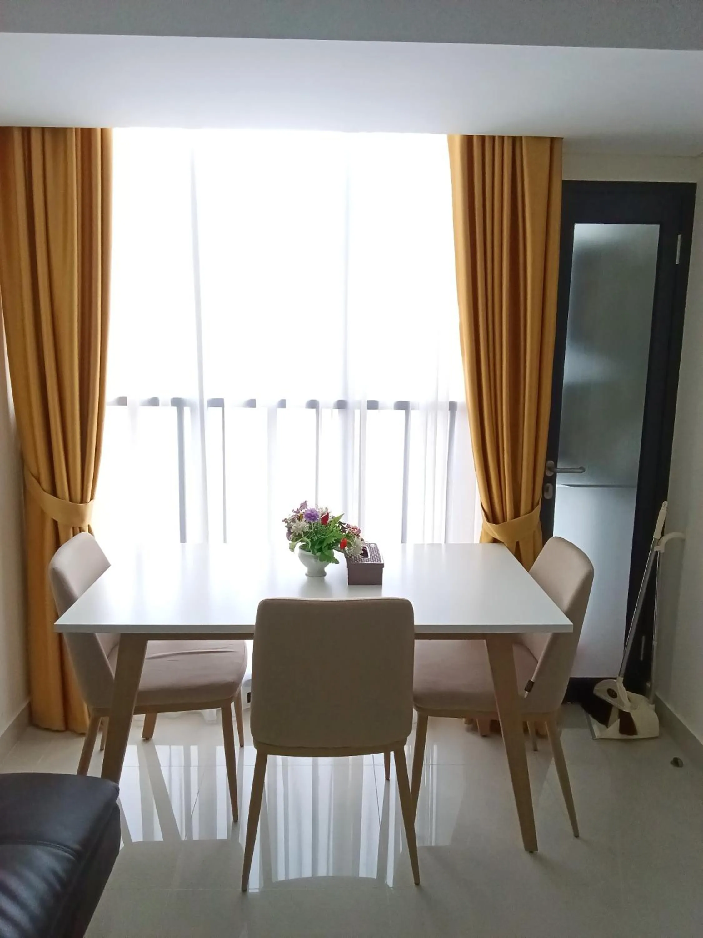 Dining area in Palam Mansion at Meisterstadt Pollux Habibie Apartment