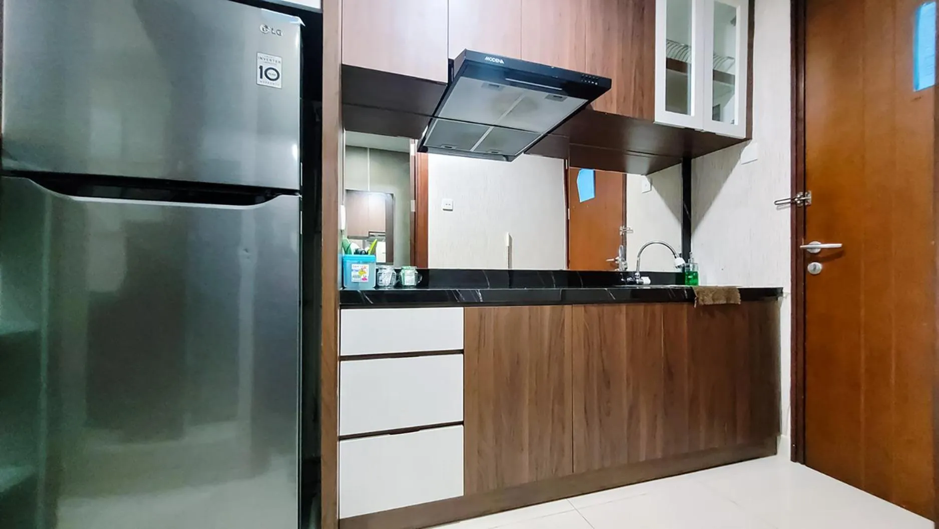 Kitchen or kitchenette in Palam Mansion at Meisterstadt Pollux Habibie Apartment