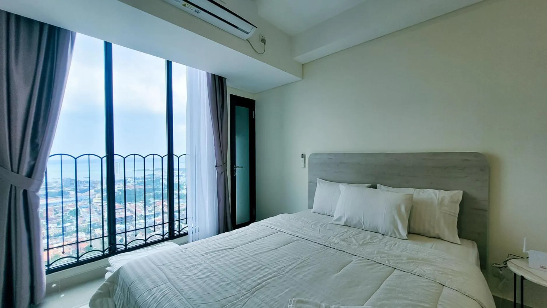 Bed in Palam Mansion at Meisterstadt Pollux Habibie Apartment