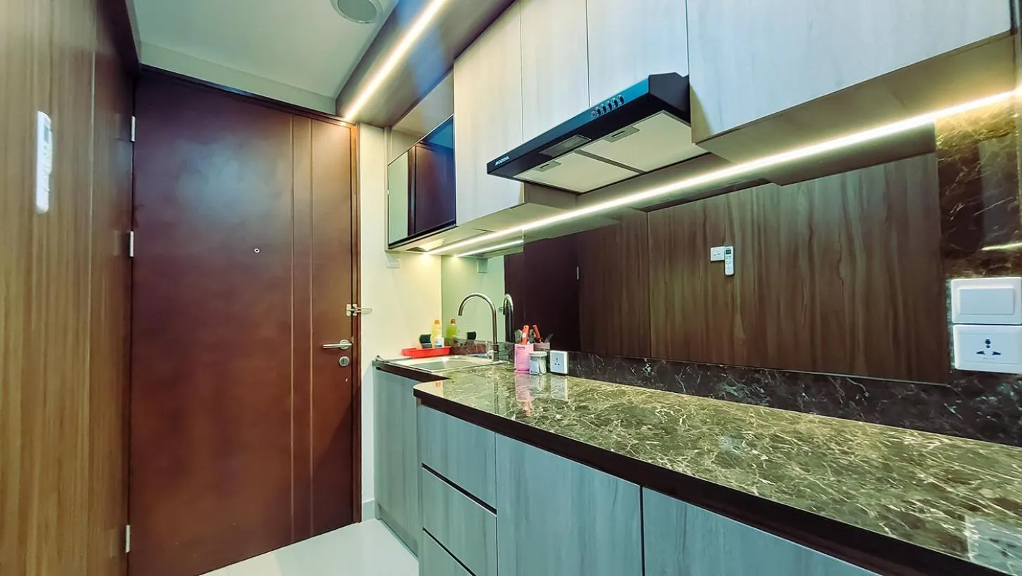 Kitchen or kitchenette in Palam Mansion at Meisterstadt Pollux Habibie Apartment