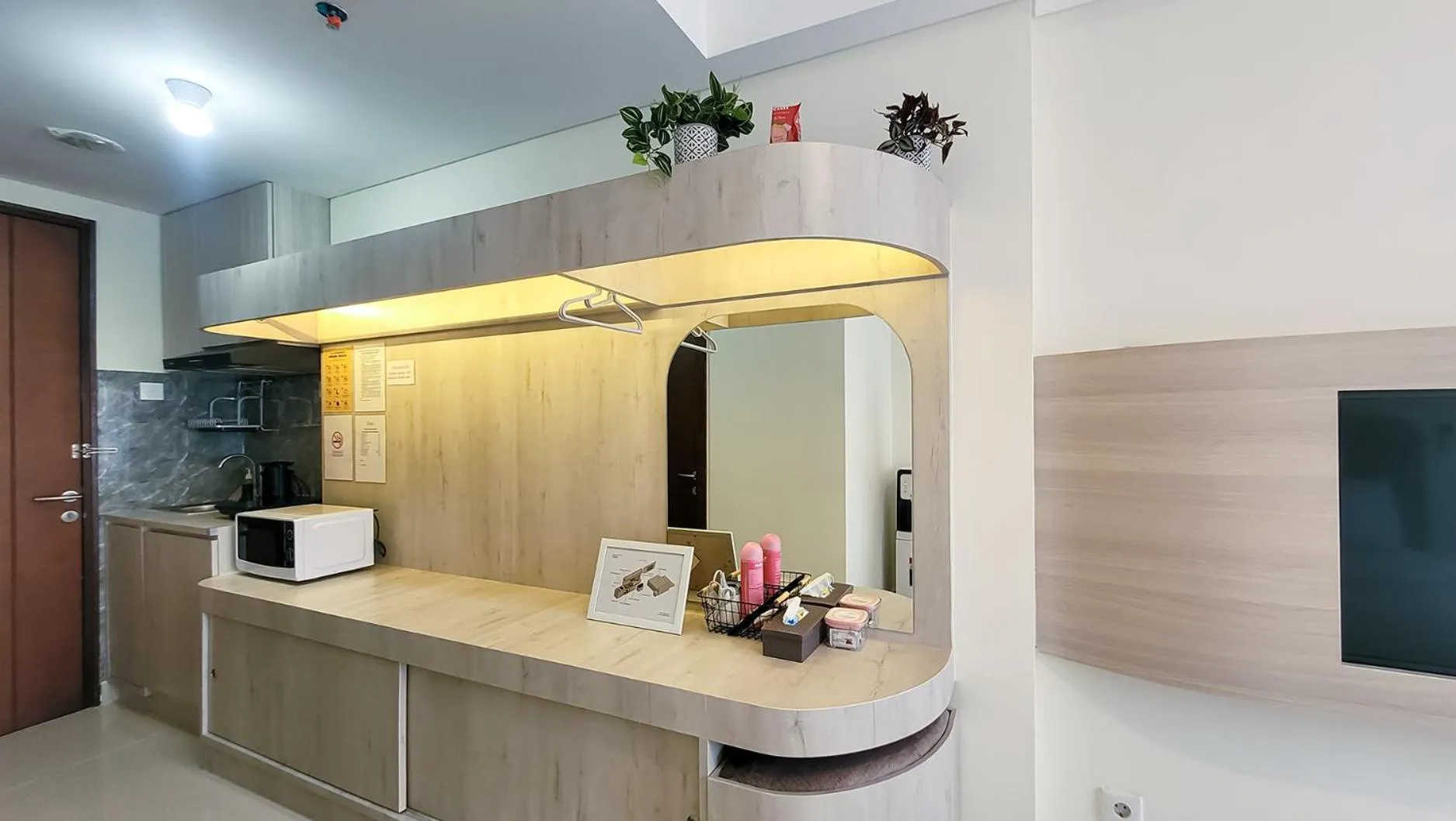 Kitchen or kitchenette in Palam Mansion at Meisterstadt Pollux Habibie Apartment