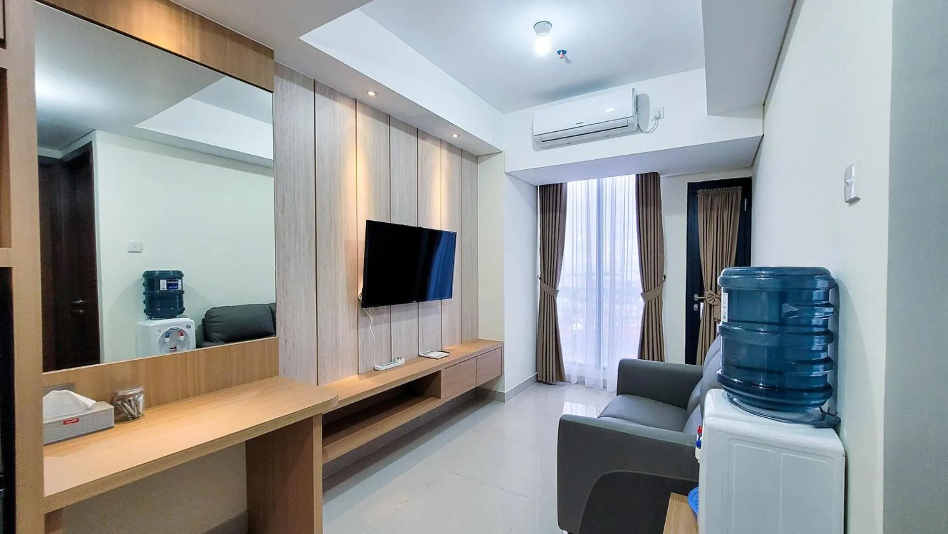 TV and multimedia in Palam Mansion at Meisterstadt Pollux Habibie Apartment