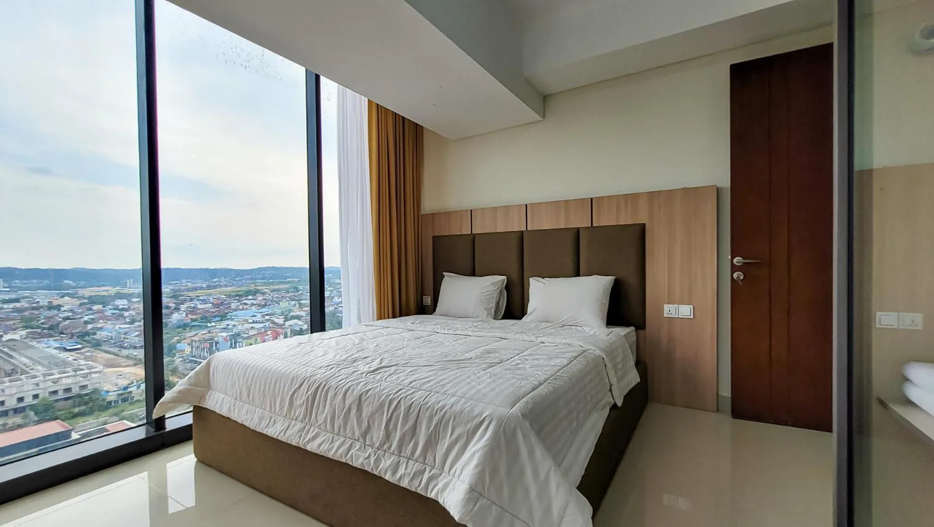 Bed in Palam Mansion at Meisterstadt Pollux Habibie Apartment