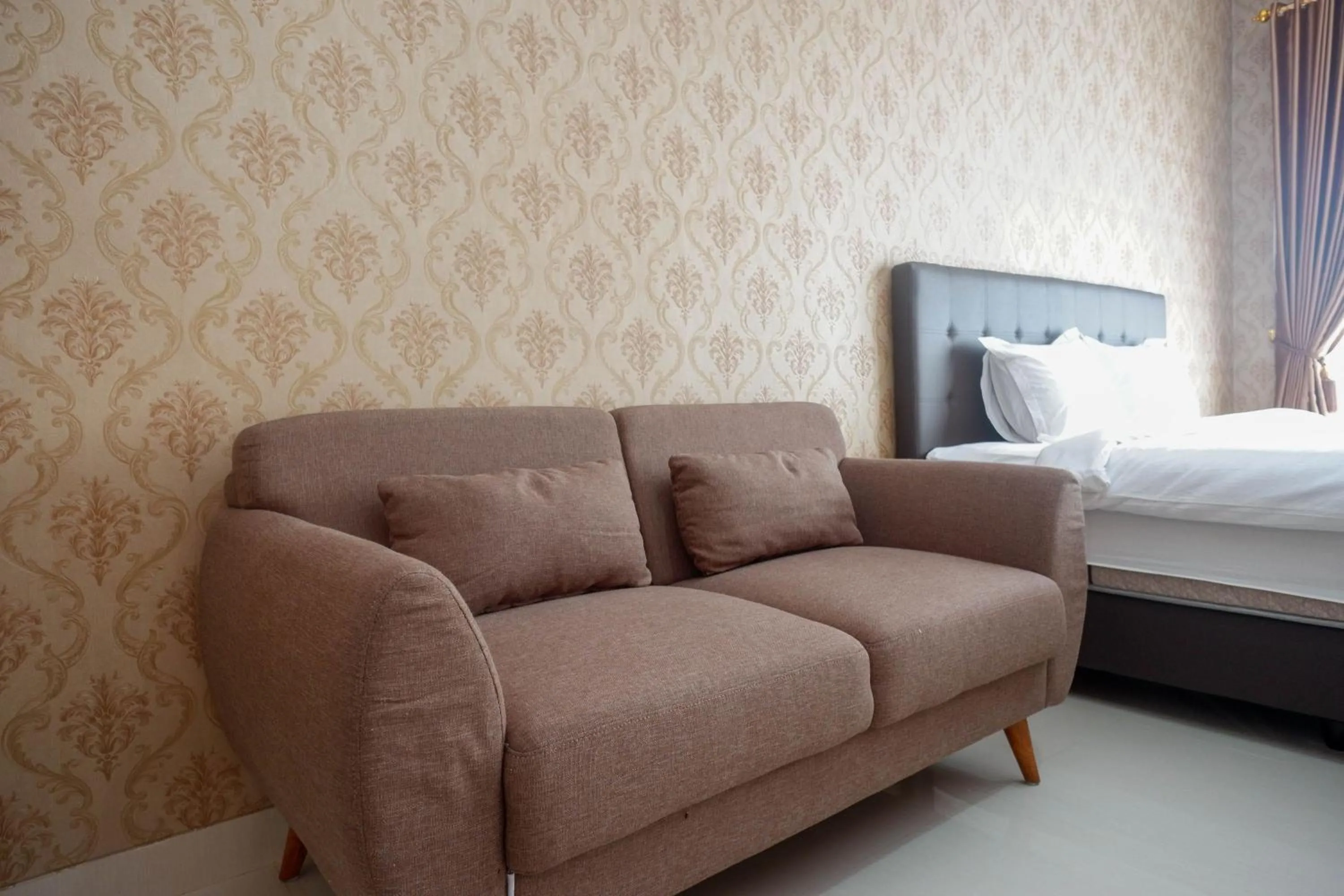 Seating area, Bed in The Lavana Greenkhaza Villa Jogja