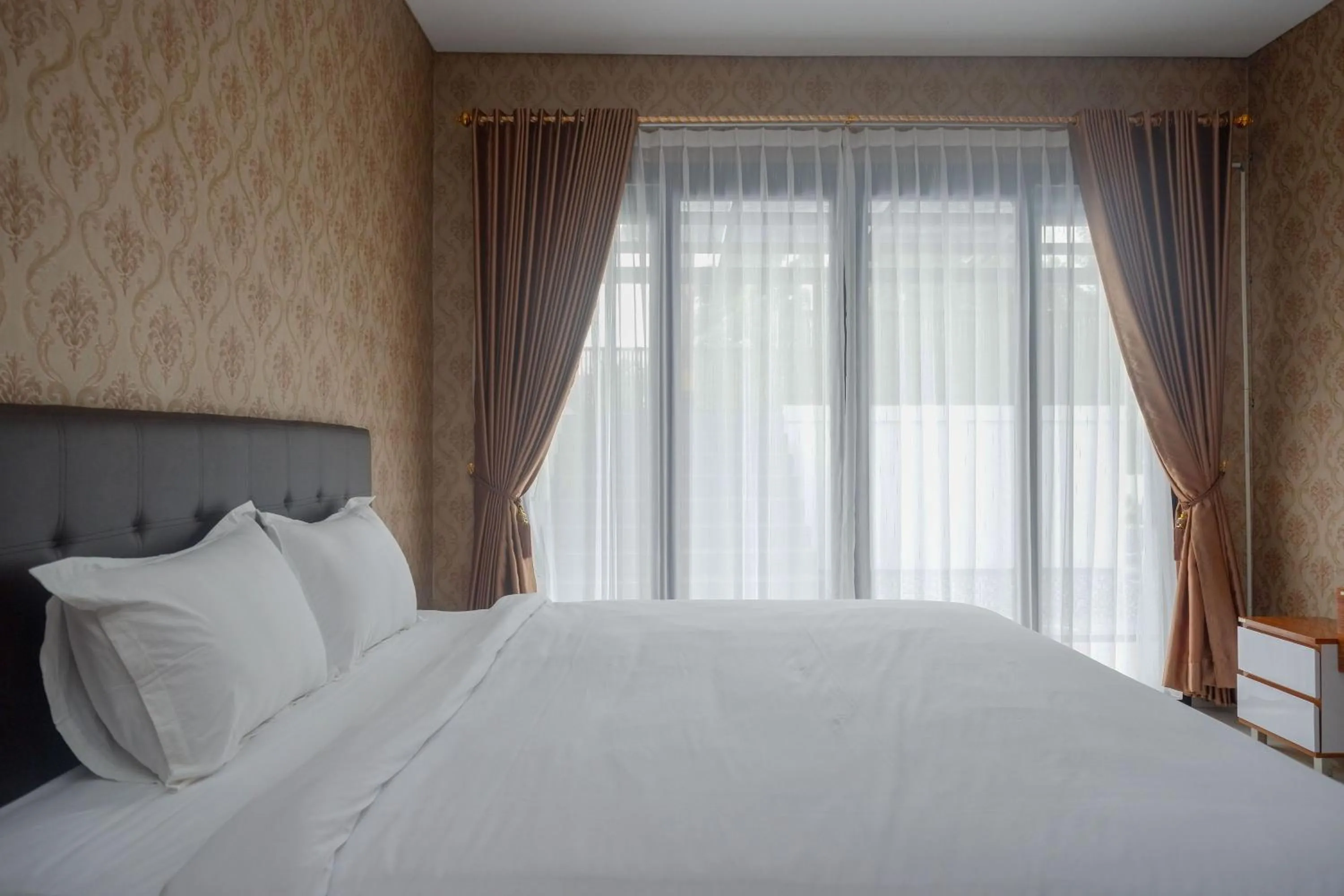 Bedroom, Bed in The Lavana Greenkhaza Villa Jogja