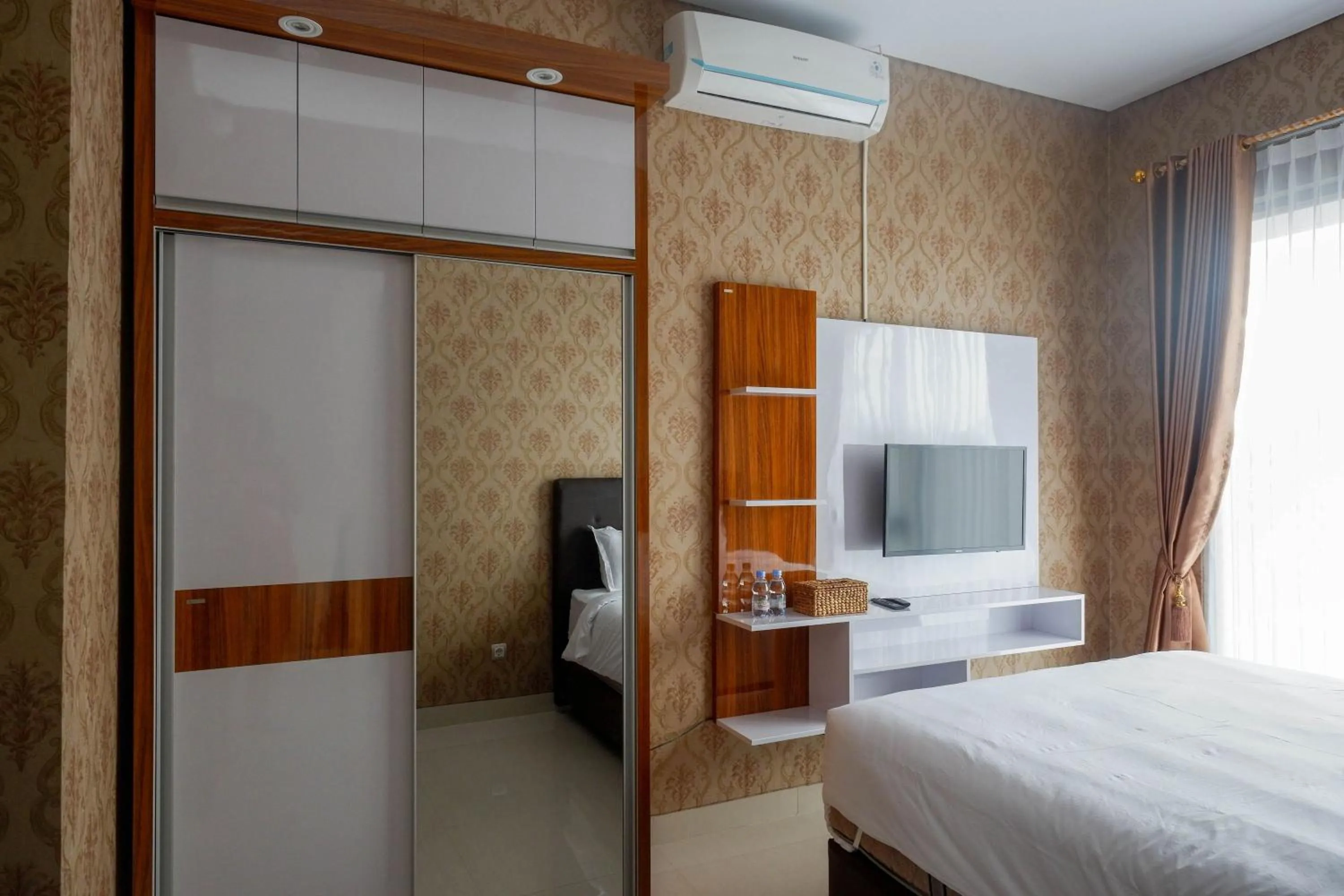 Bed in The Lavana Greenkhaza Villa Jogja