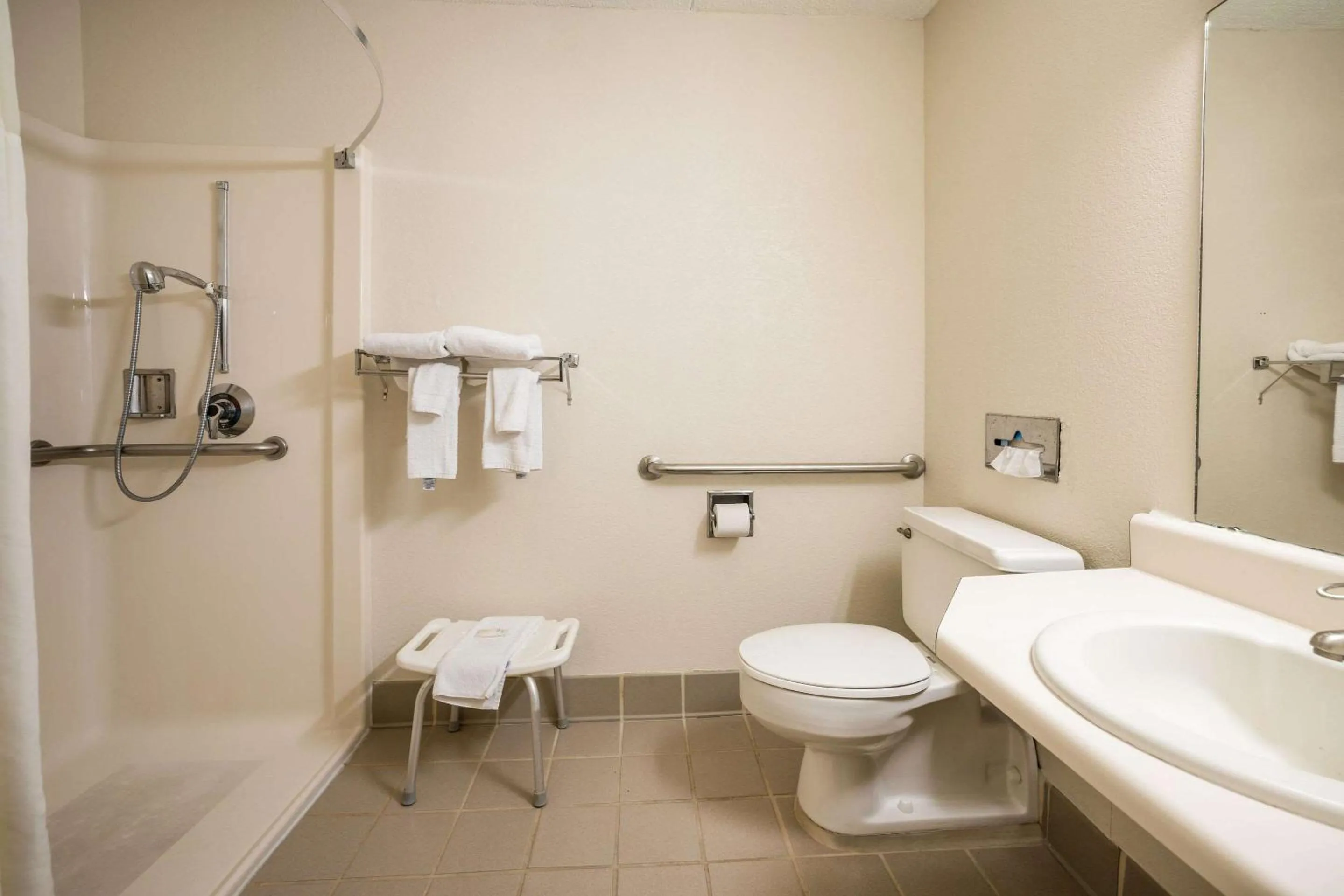 Bedroom in Suburban Studios Syracuse Fairgrounds