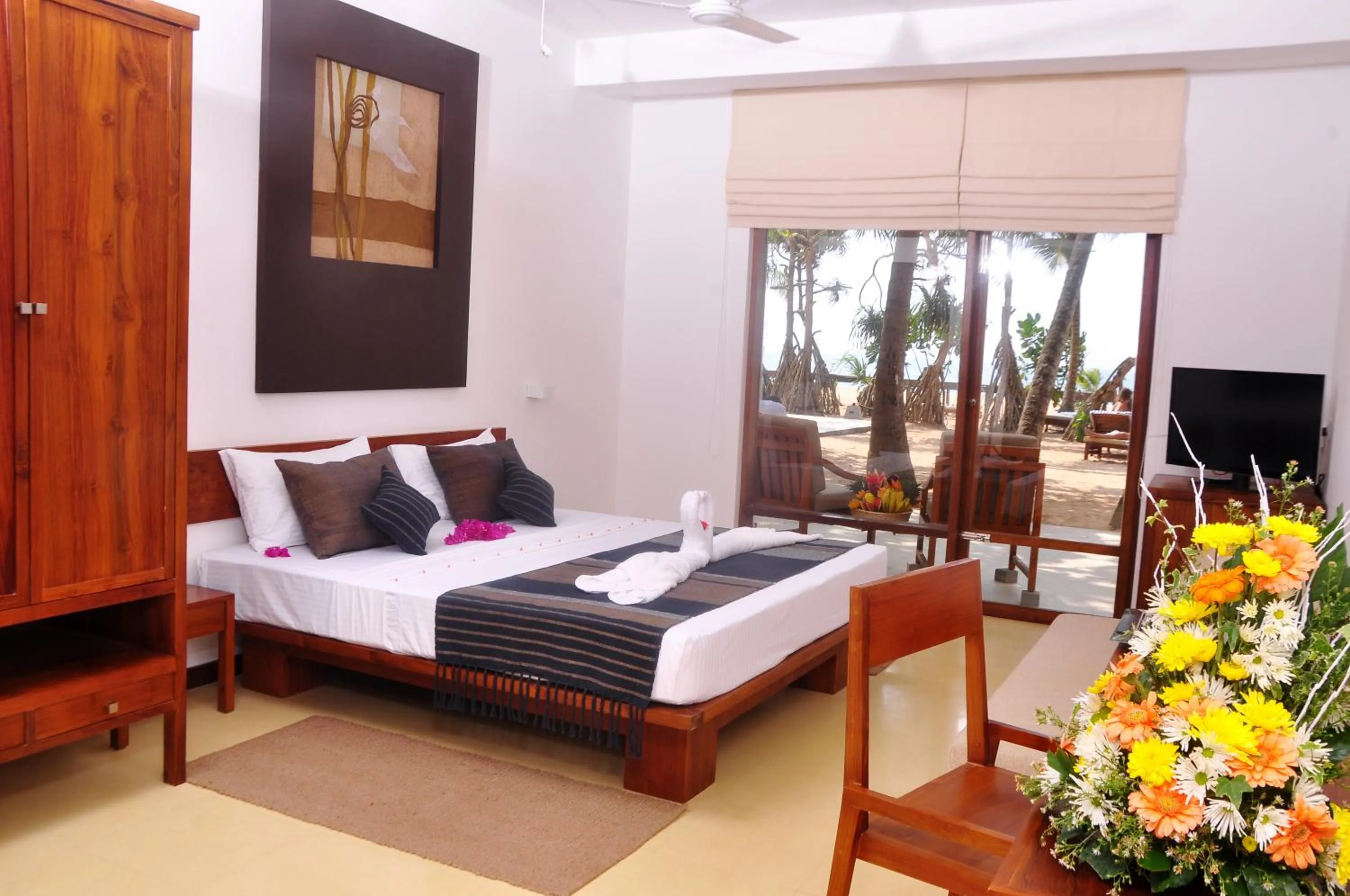 Bed in Pandanus Beach Resort & Spa