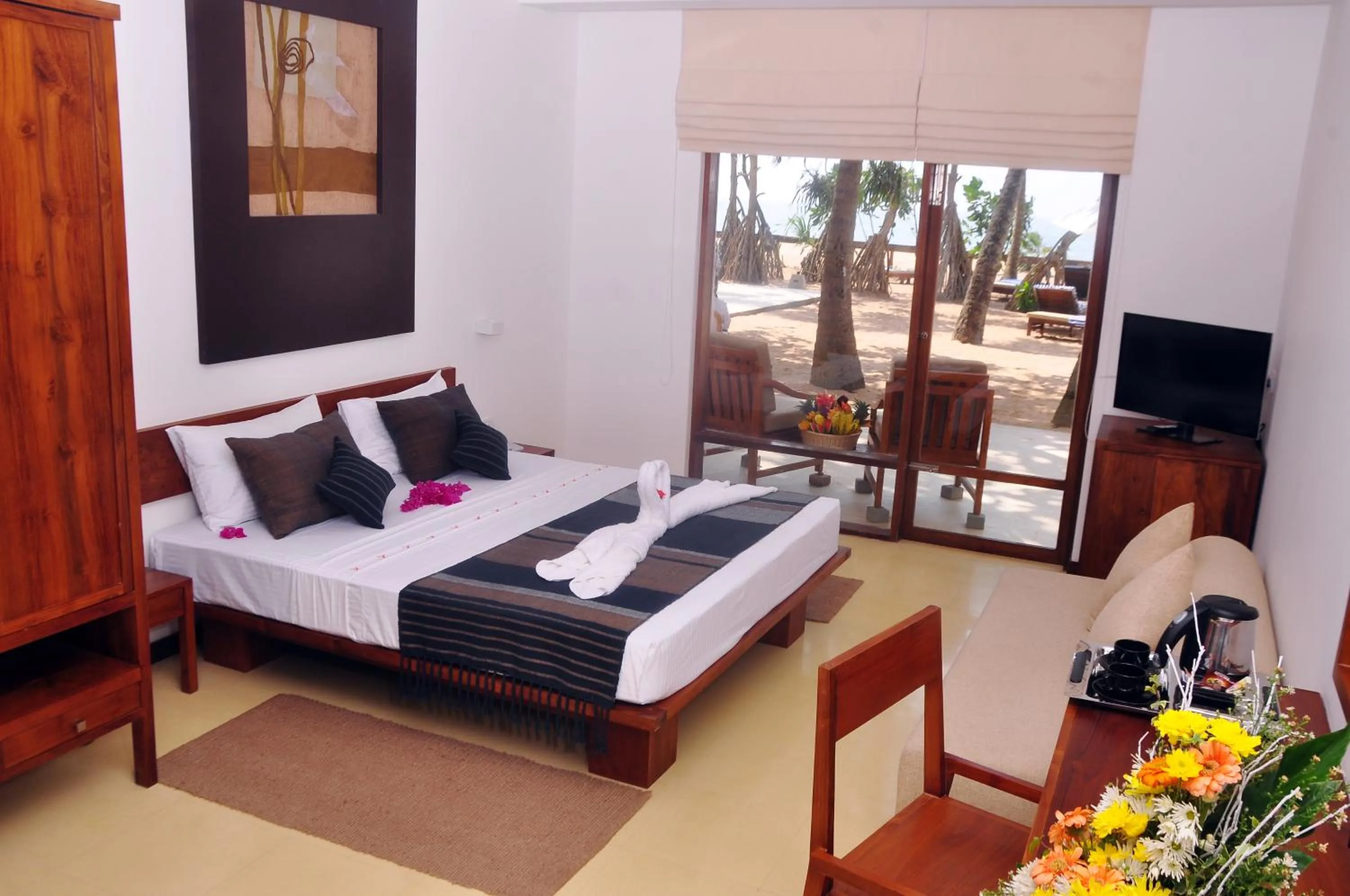 Bed in Pandanus Beach Resort & Spa