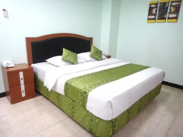 Bed in Karsa Utama Hotel