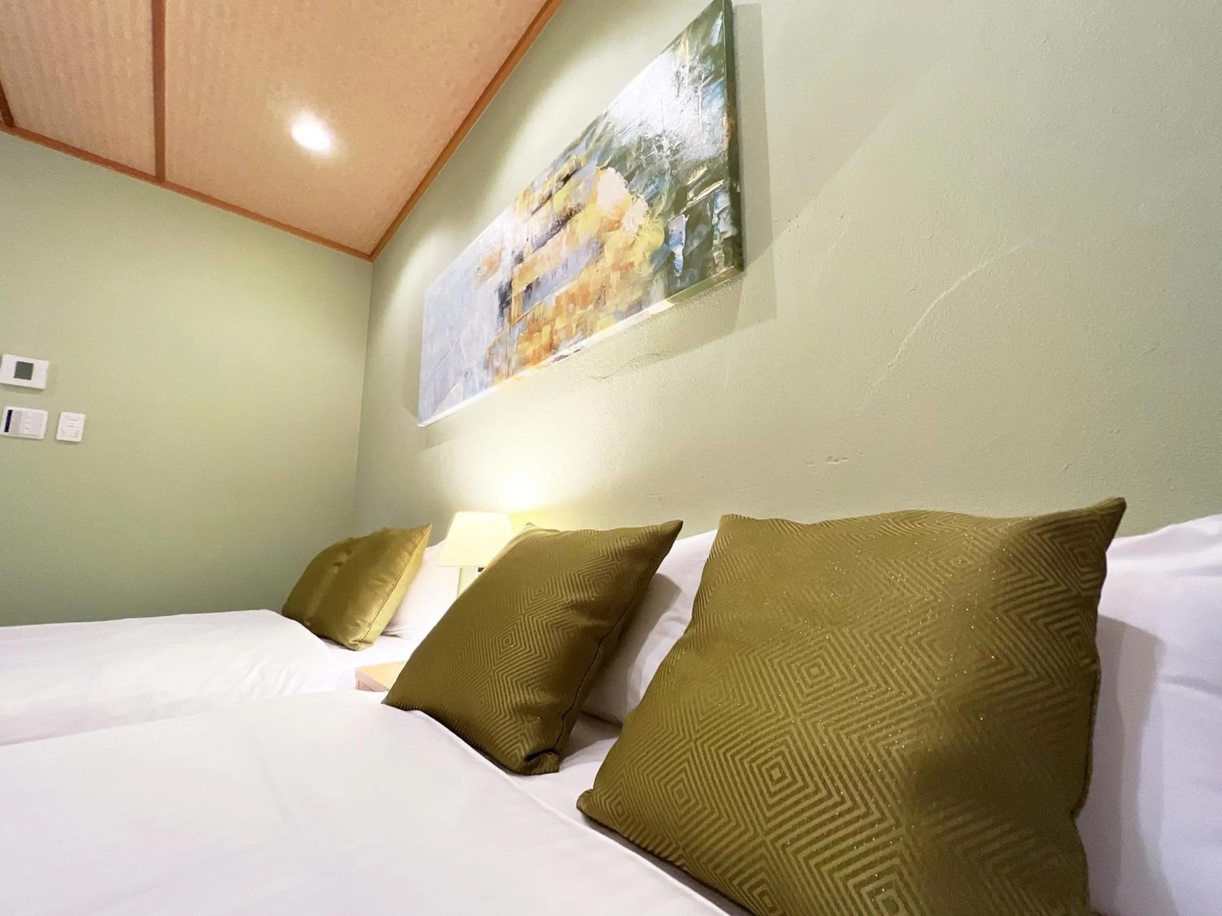 Bed in OWL RESORT ARIFUKU ONSEN