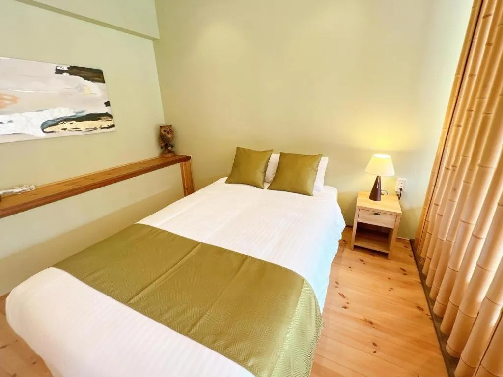 Bed in OWL RESORT ARIFUKU ONSEN