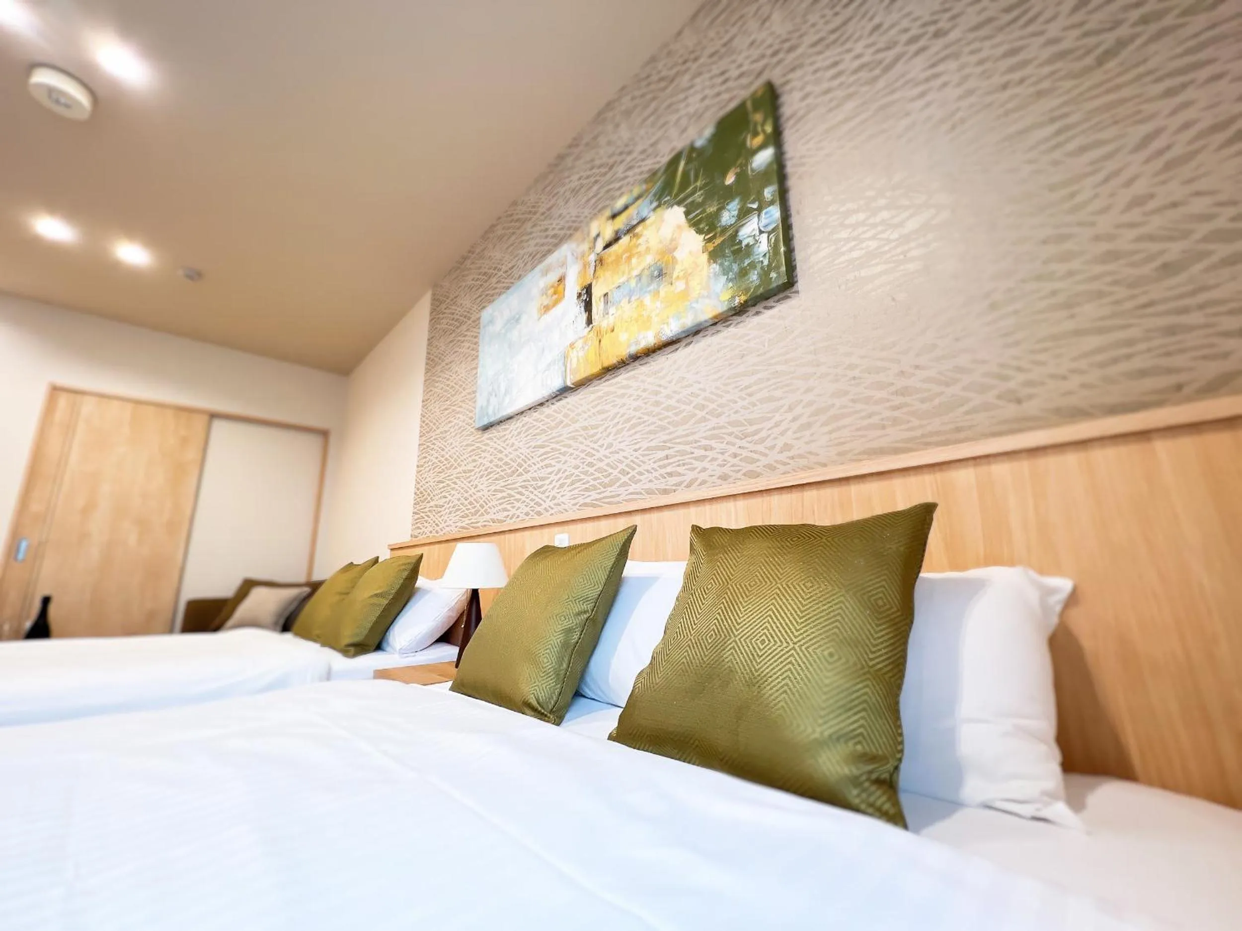 Bed in OWL RESORT ARIFUKU ONSEN