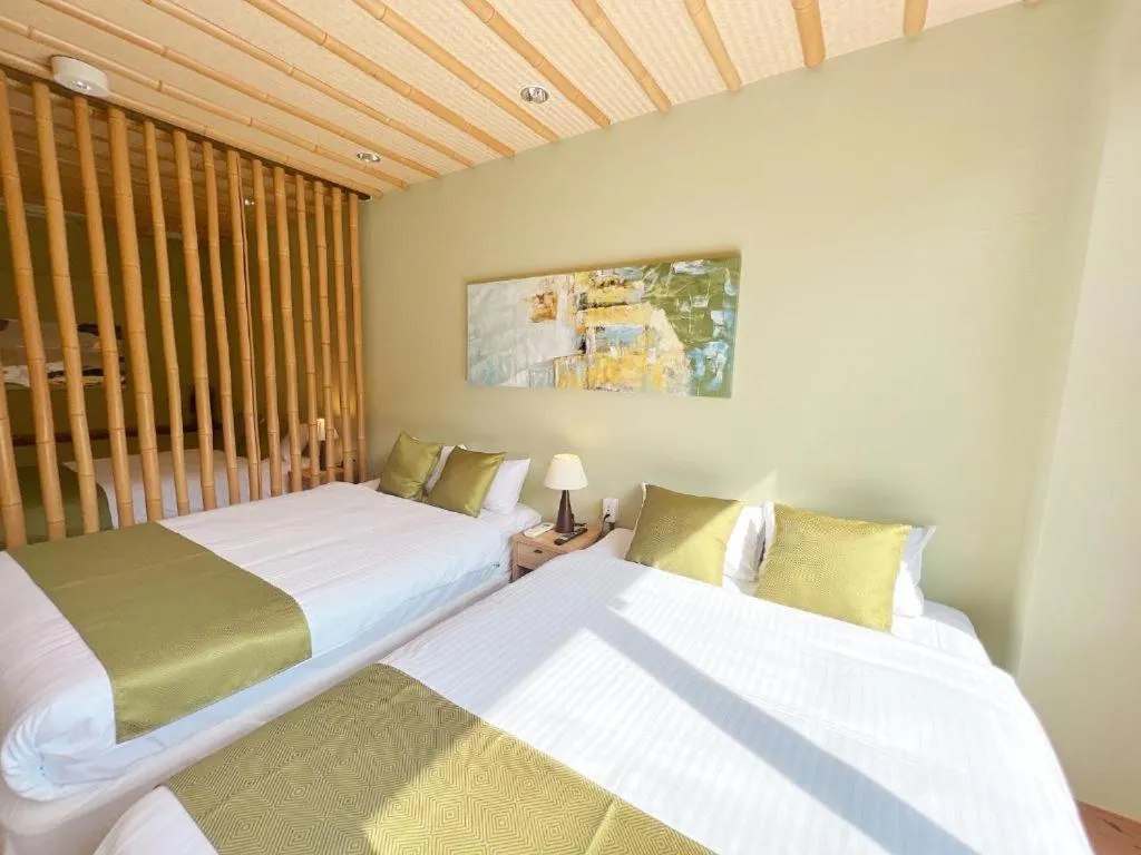 Bed in OWL RESORT ARIFUKU ONSEN