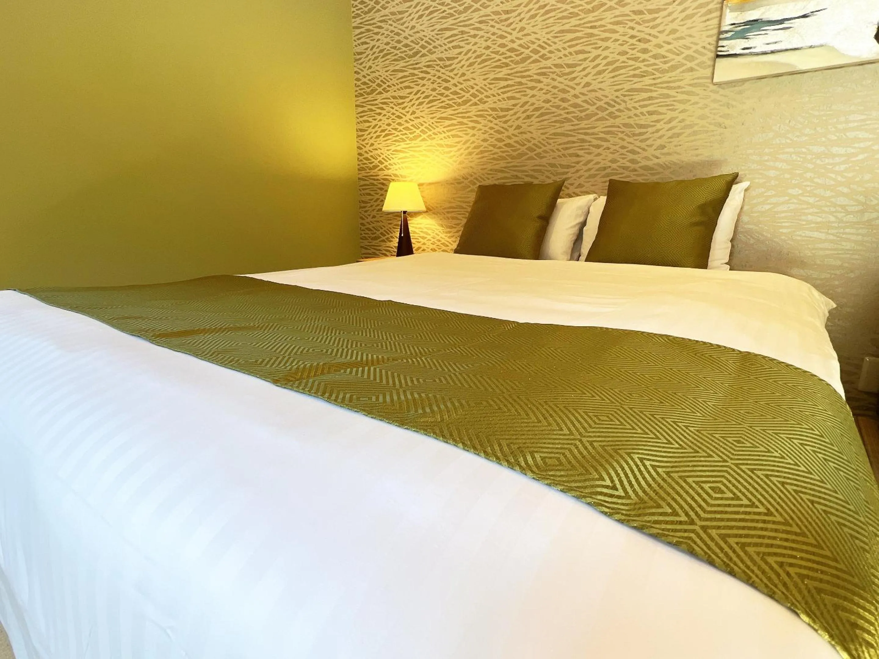 Bed in OWL RESORT ARIFUKU ONSEN