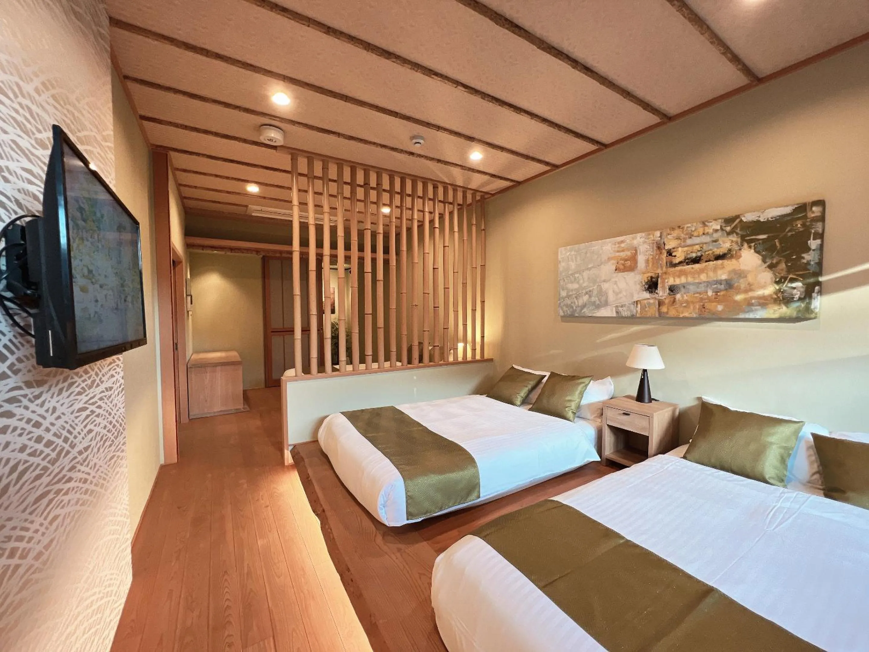 Bed in OWL RESORT ARIFUKU ONSEN