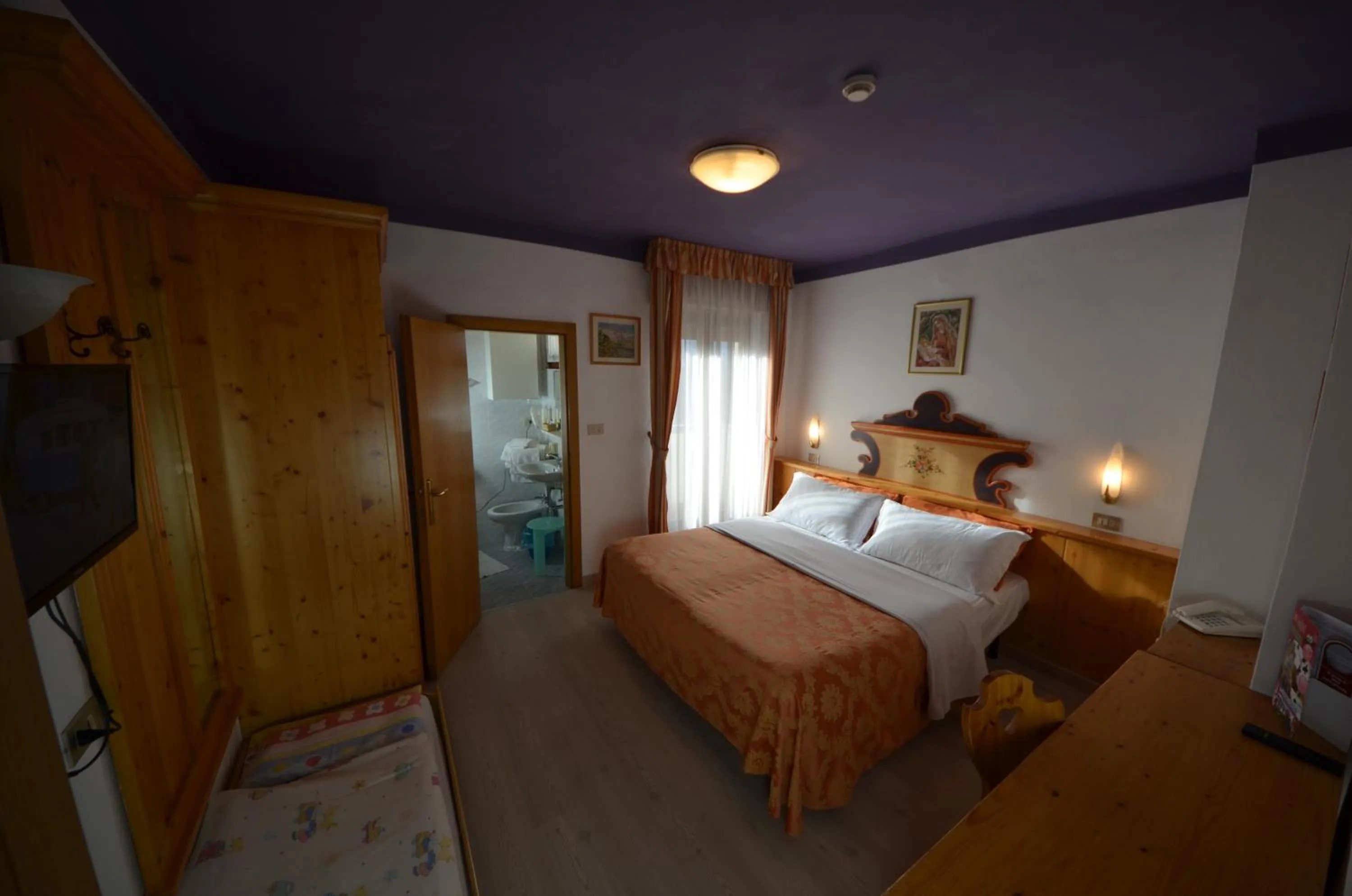 Bed in Family Hotel Primavera