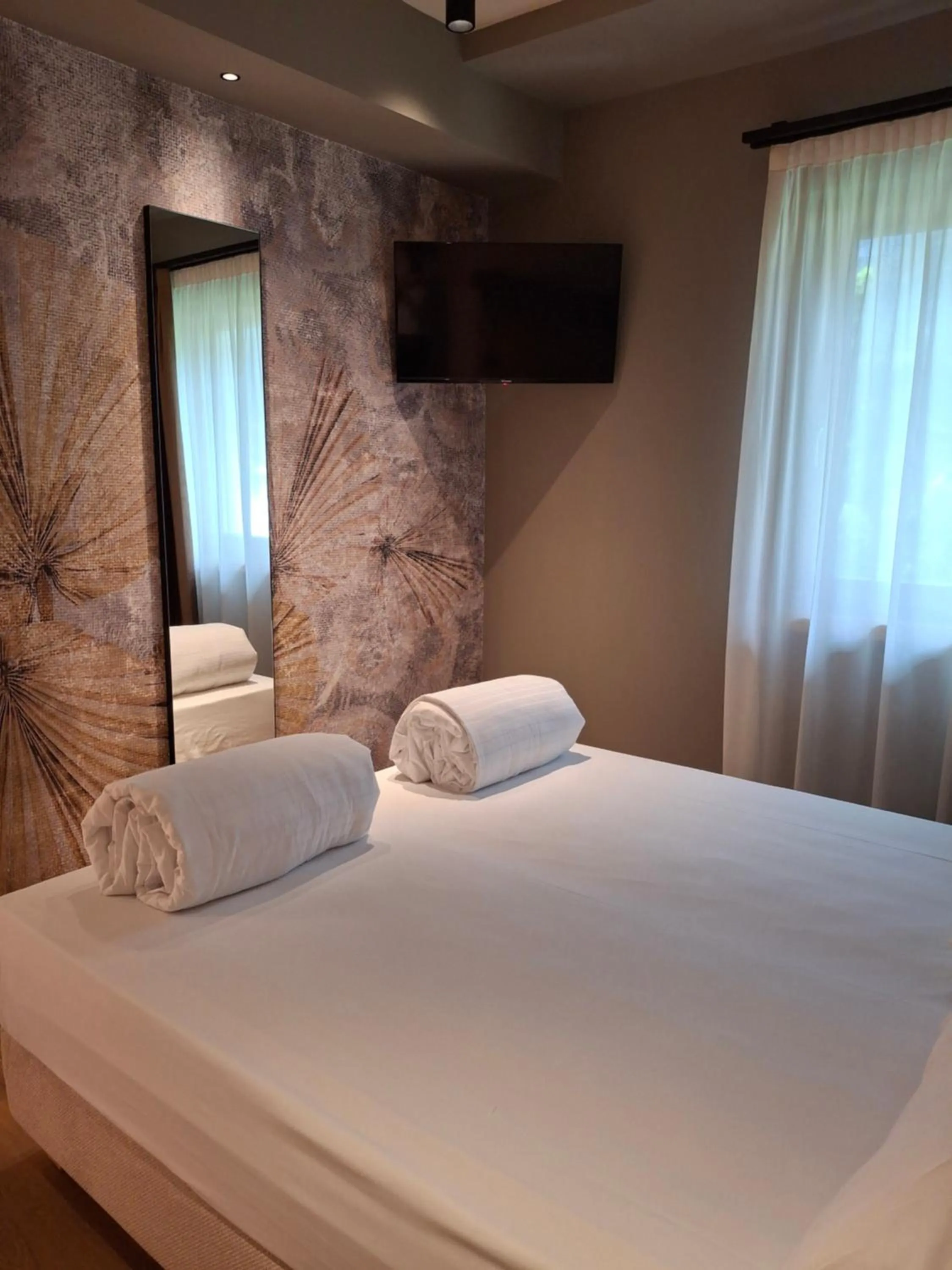 Bed in Hotel Dolomiti Saone