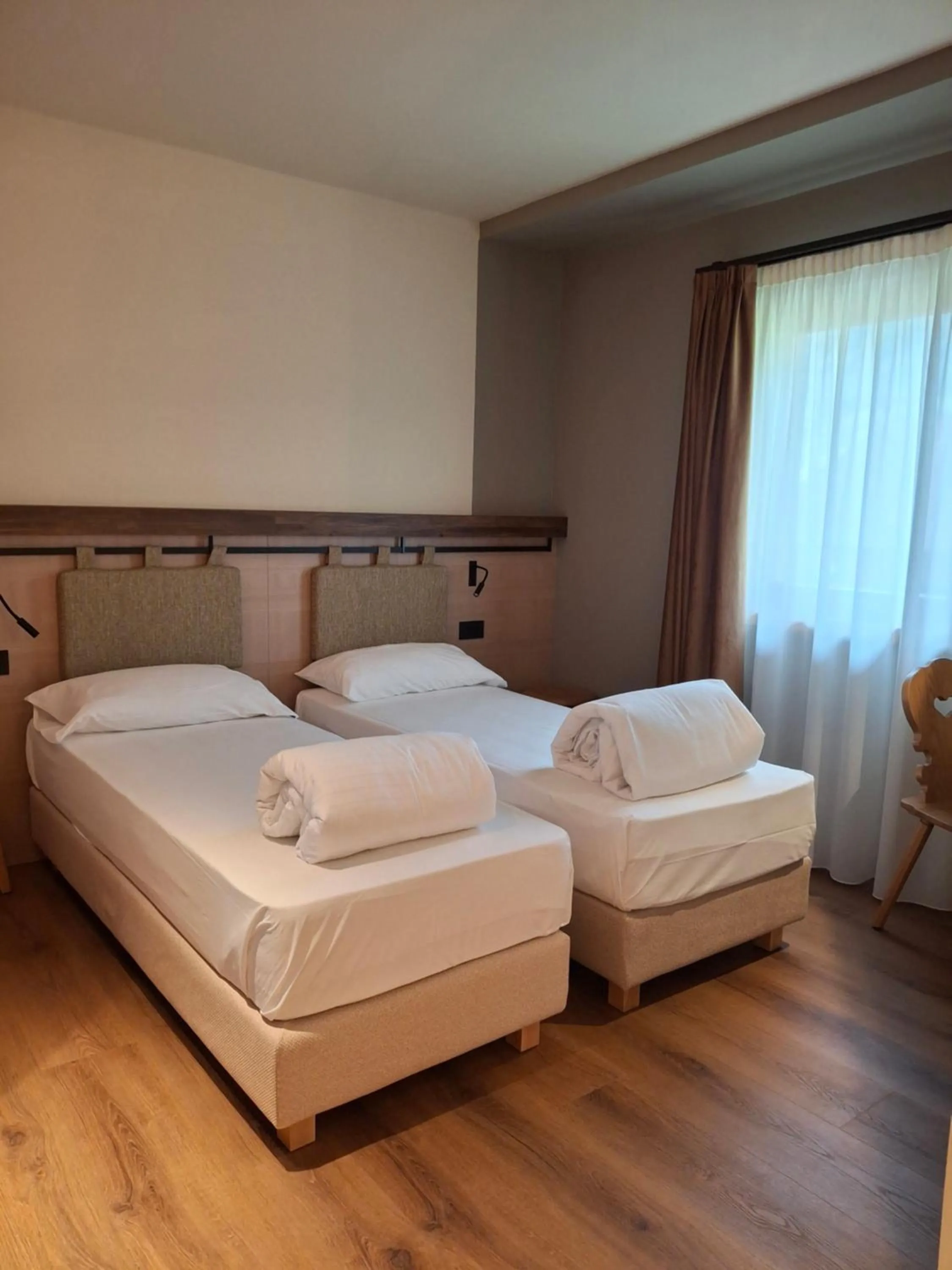 Bed in Hotel Dolomiti Saone