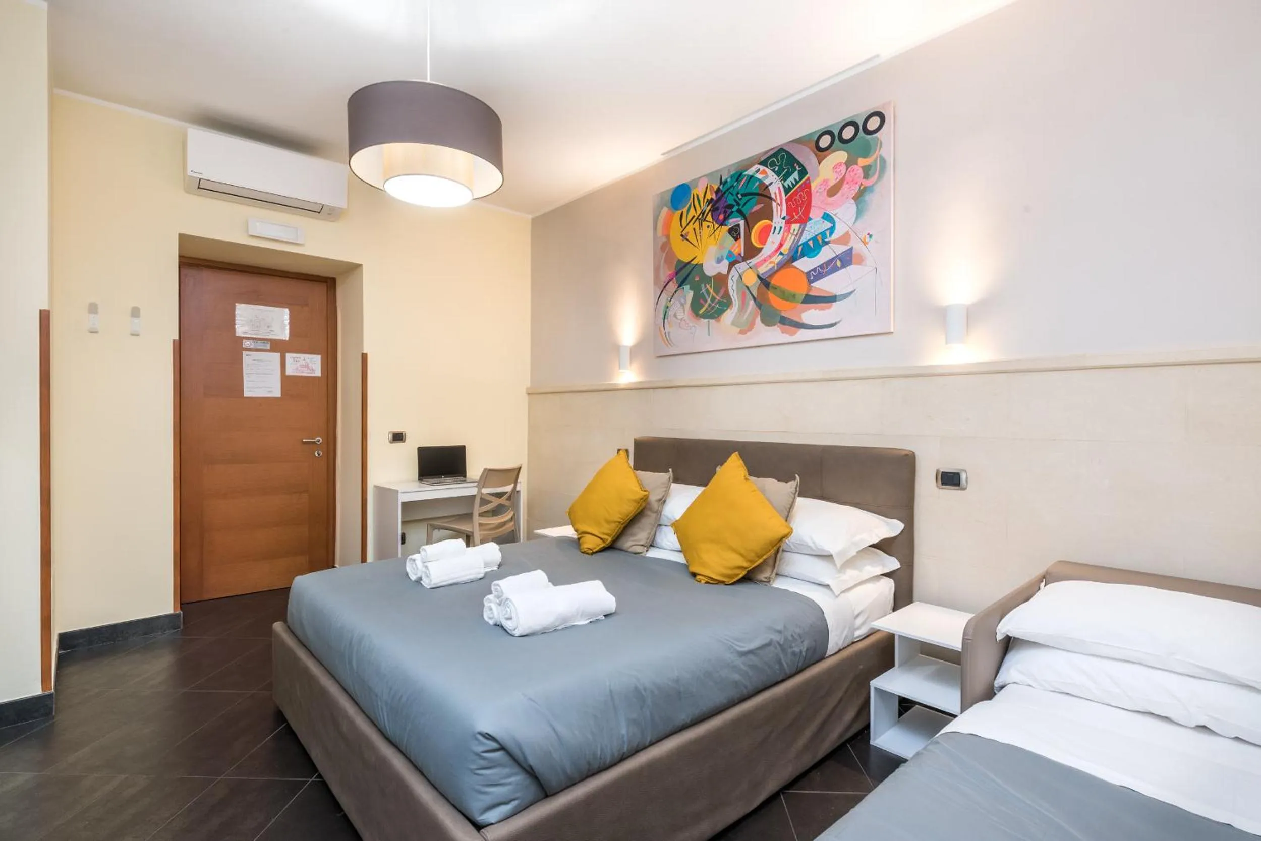 Bed in Cardinal Vatican Inn