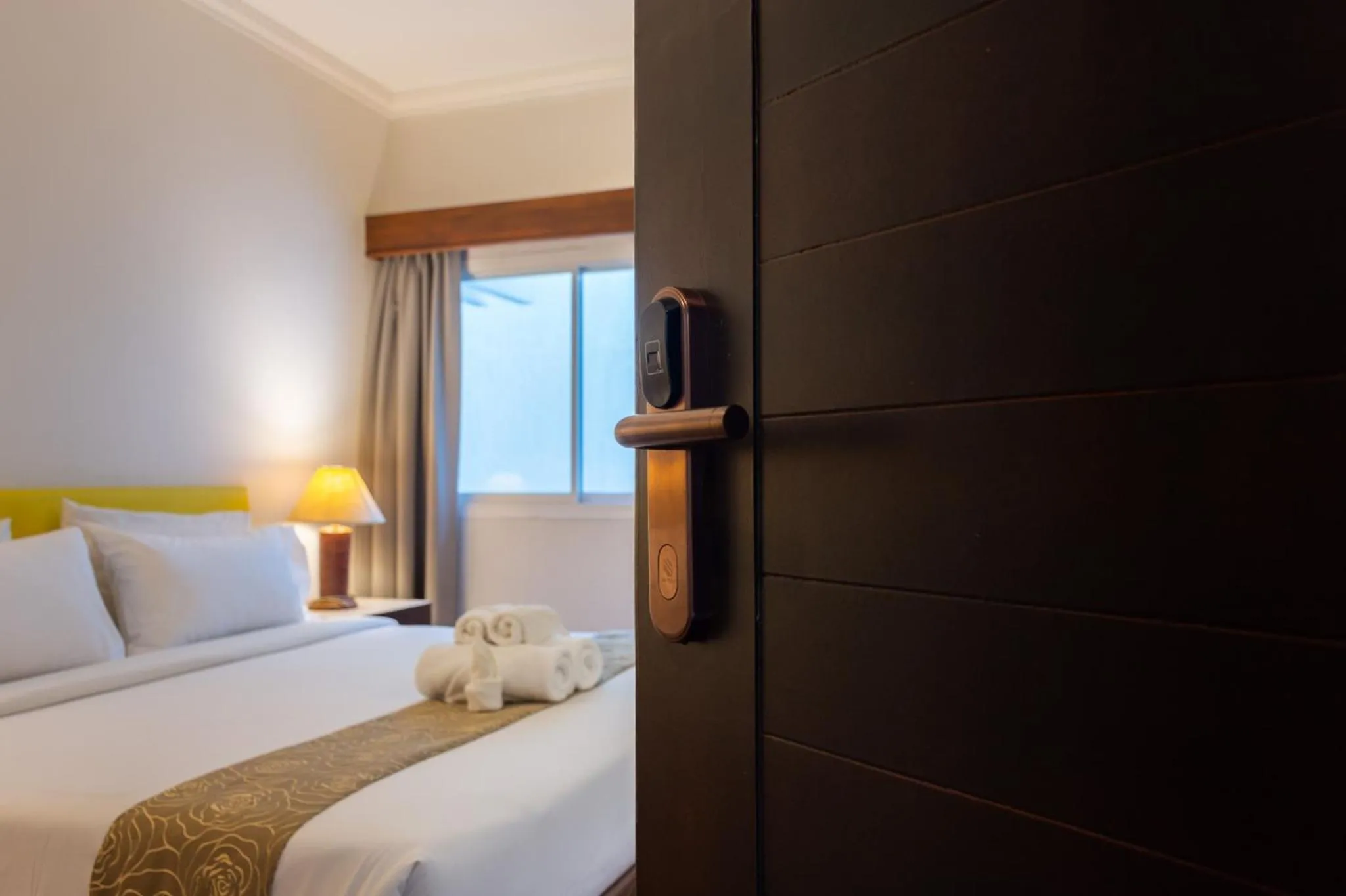 Bed in Mayflower Grand Hotel Korat