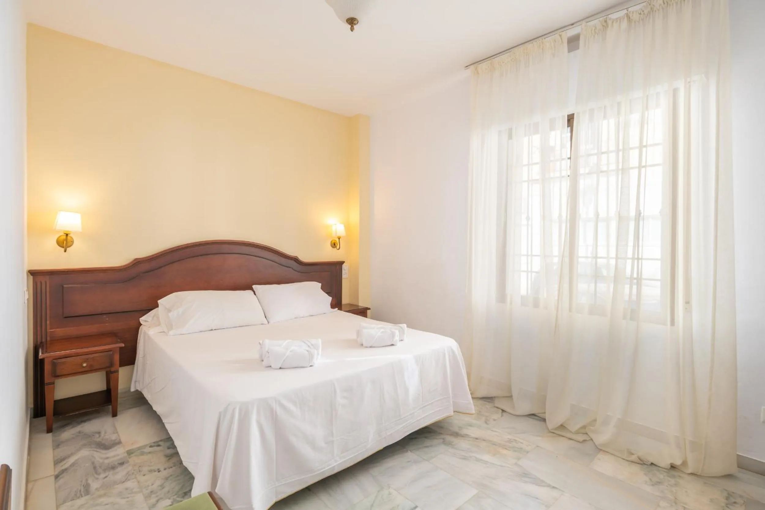 Bedroom, Bed in Apartahotel Playamaro by Dorobe