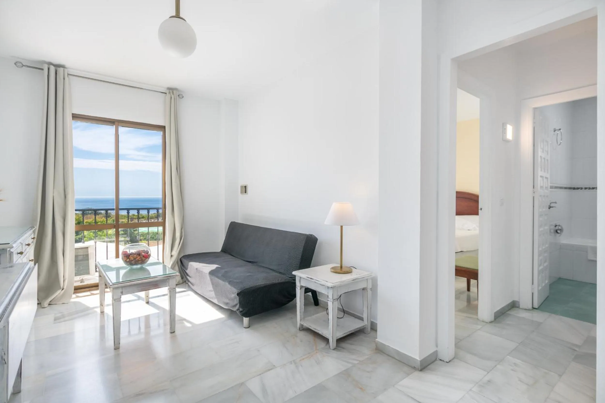 Living room in Apartahotel Playamaro by Dorobe