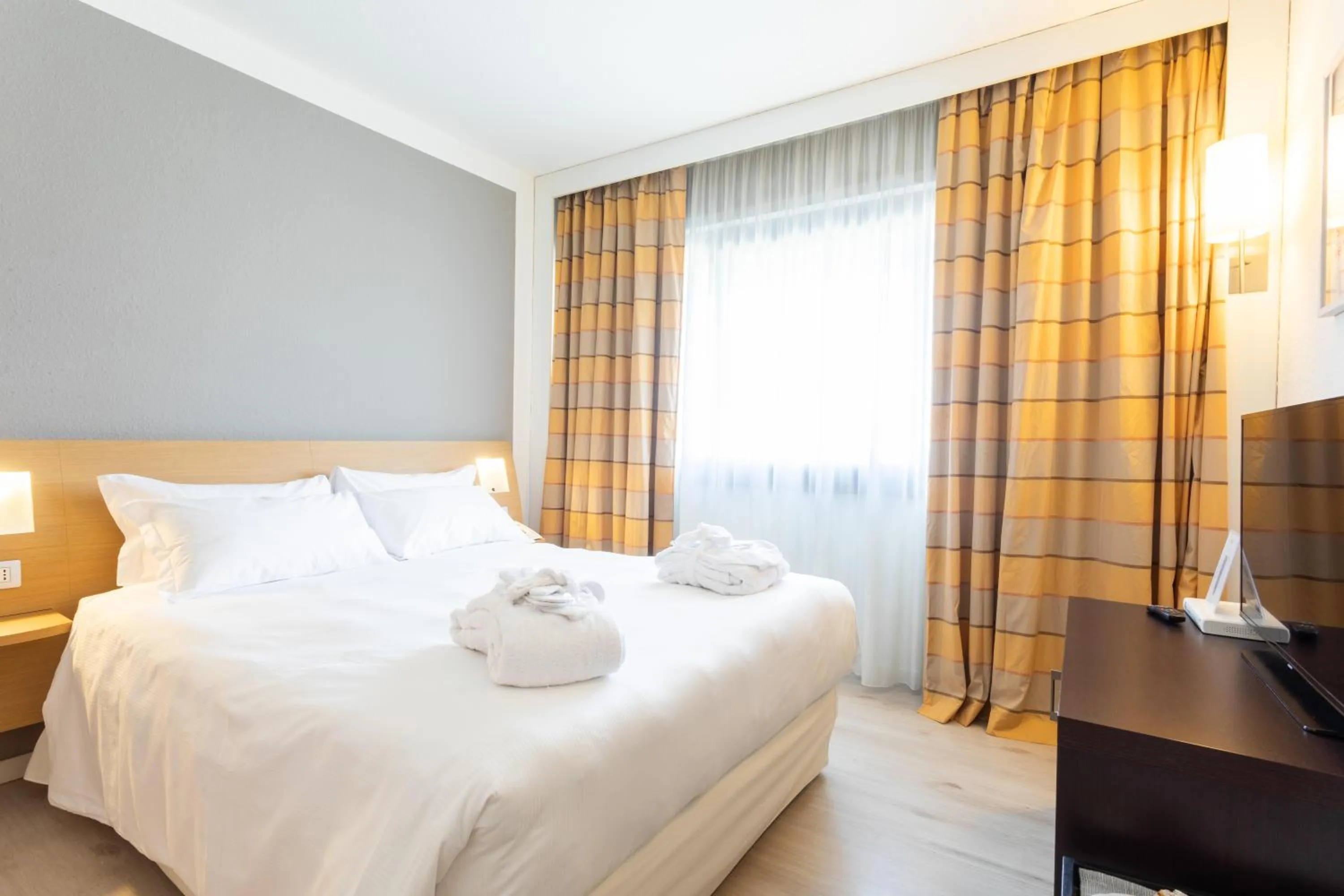 Bed in Living Place Hotel