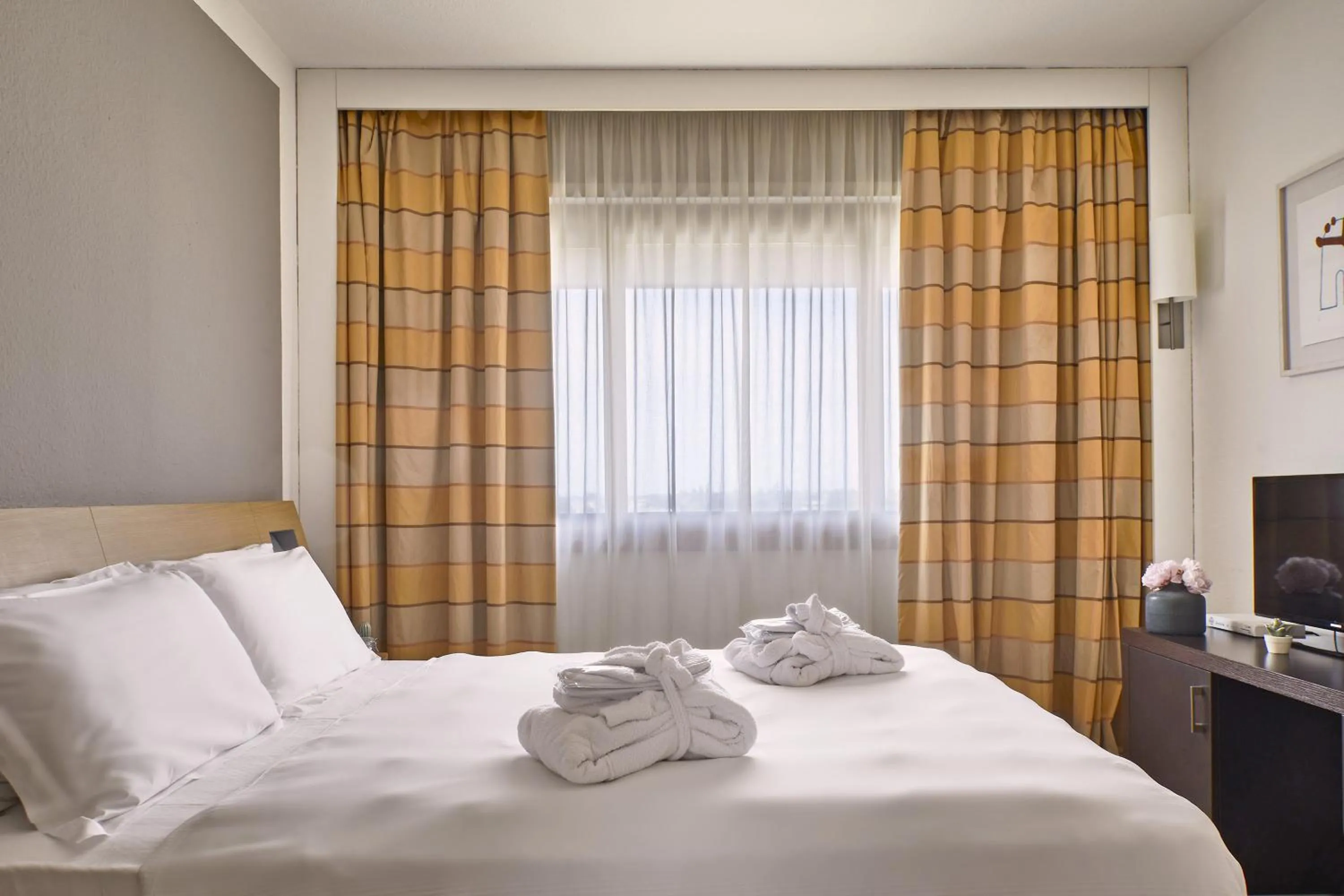 Bed in Living Place Hotel