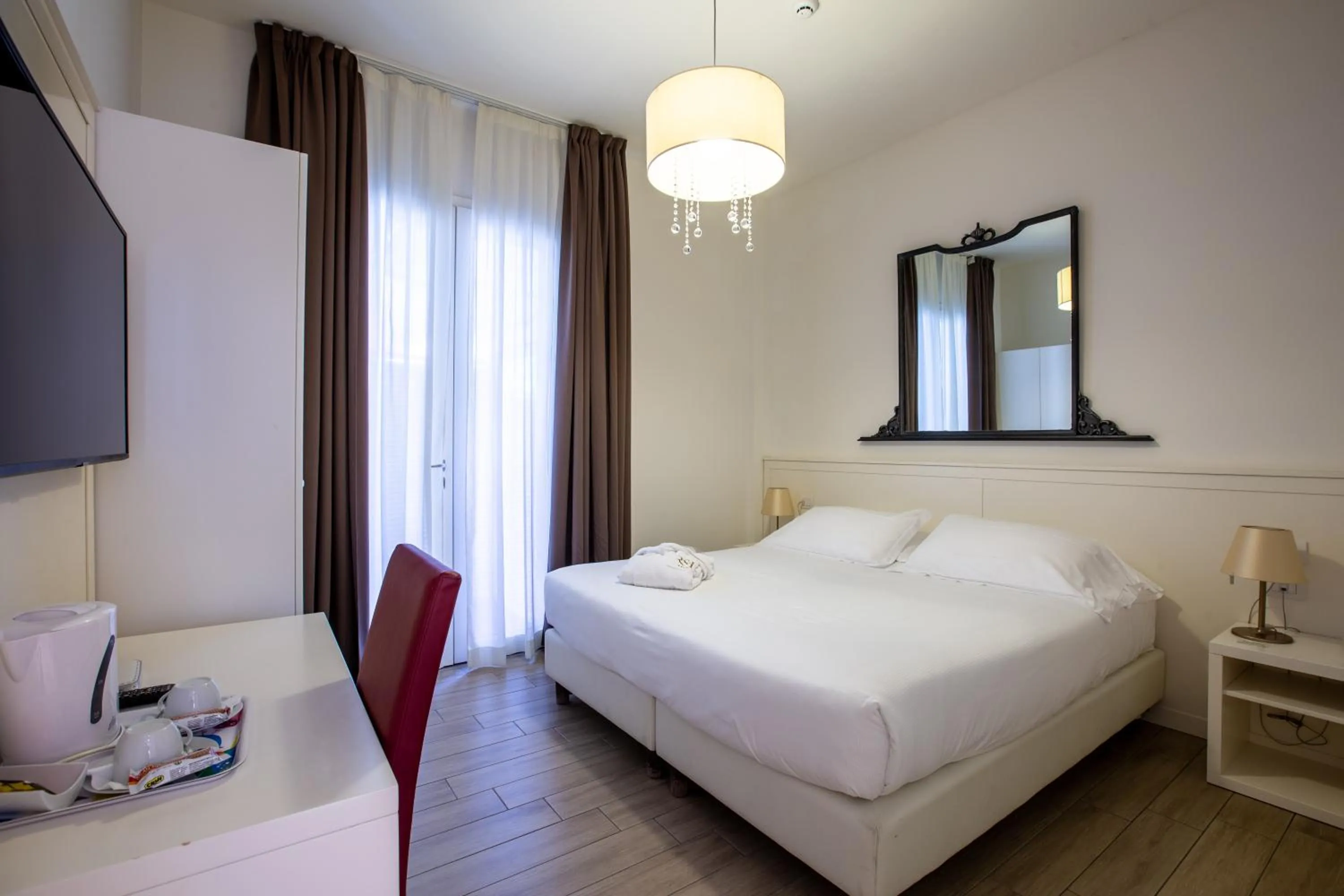 Bed in Rimini Suite Hotel