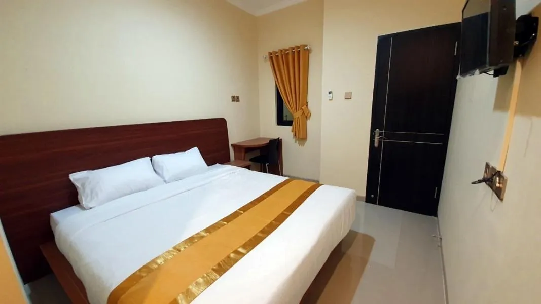 Bed in Harmony Inn Belitung - City Hotel