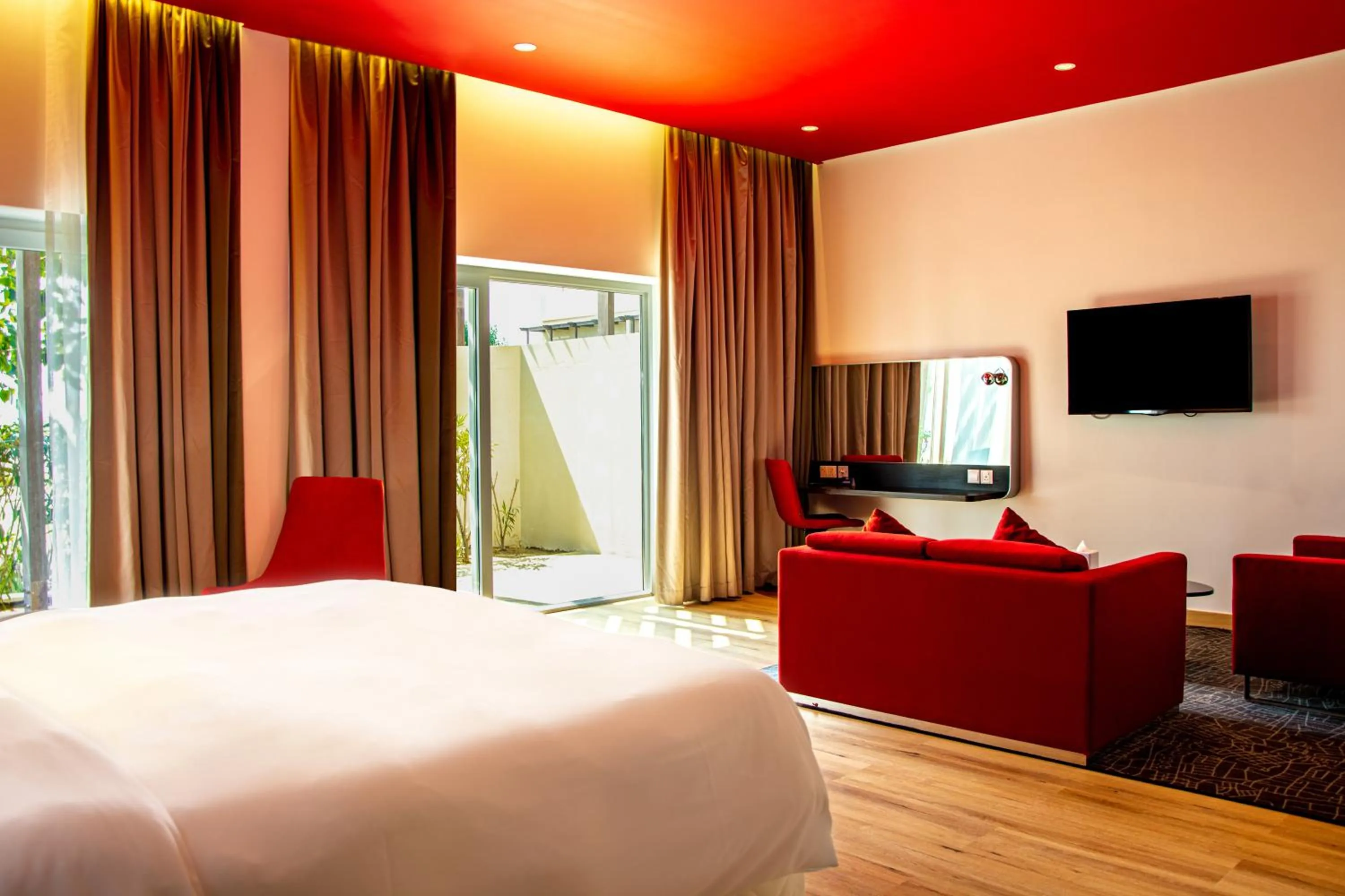 Seating area, Bed in Park Inn by Radisson Hotel and Residence Duqm