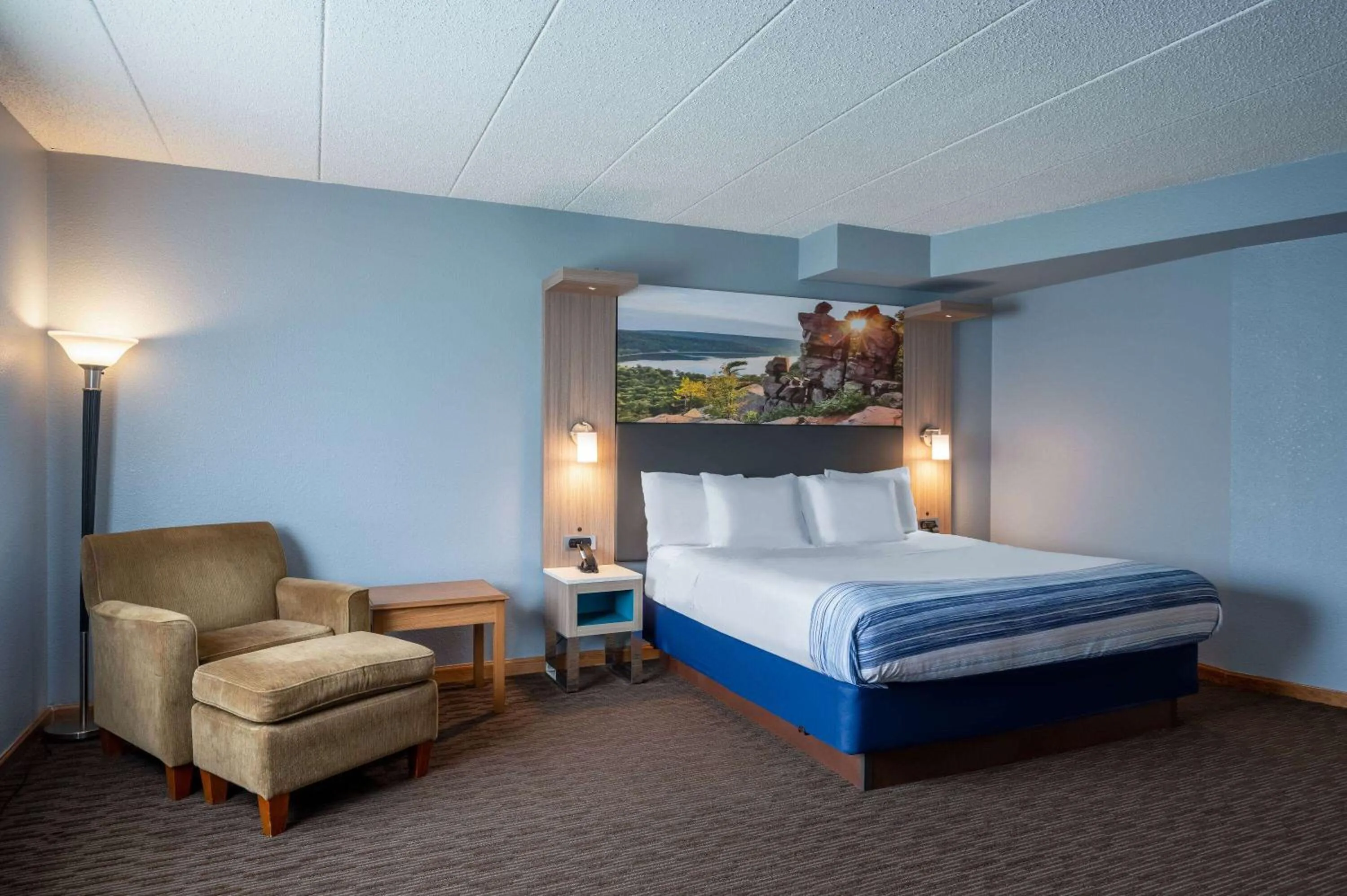 Bed in AmericInn by Wyndham Eau Claire