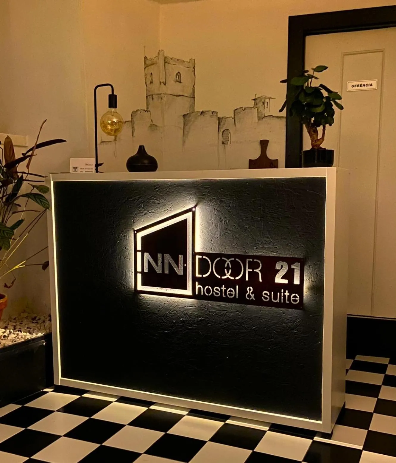 Property logo or sign in Inn Door 21 - Hostel & Suite
