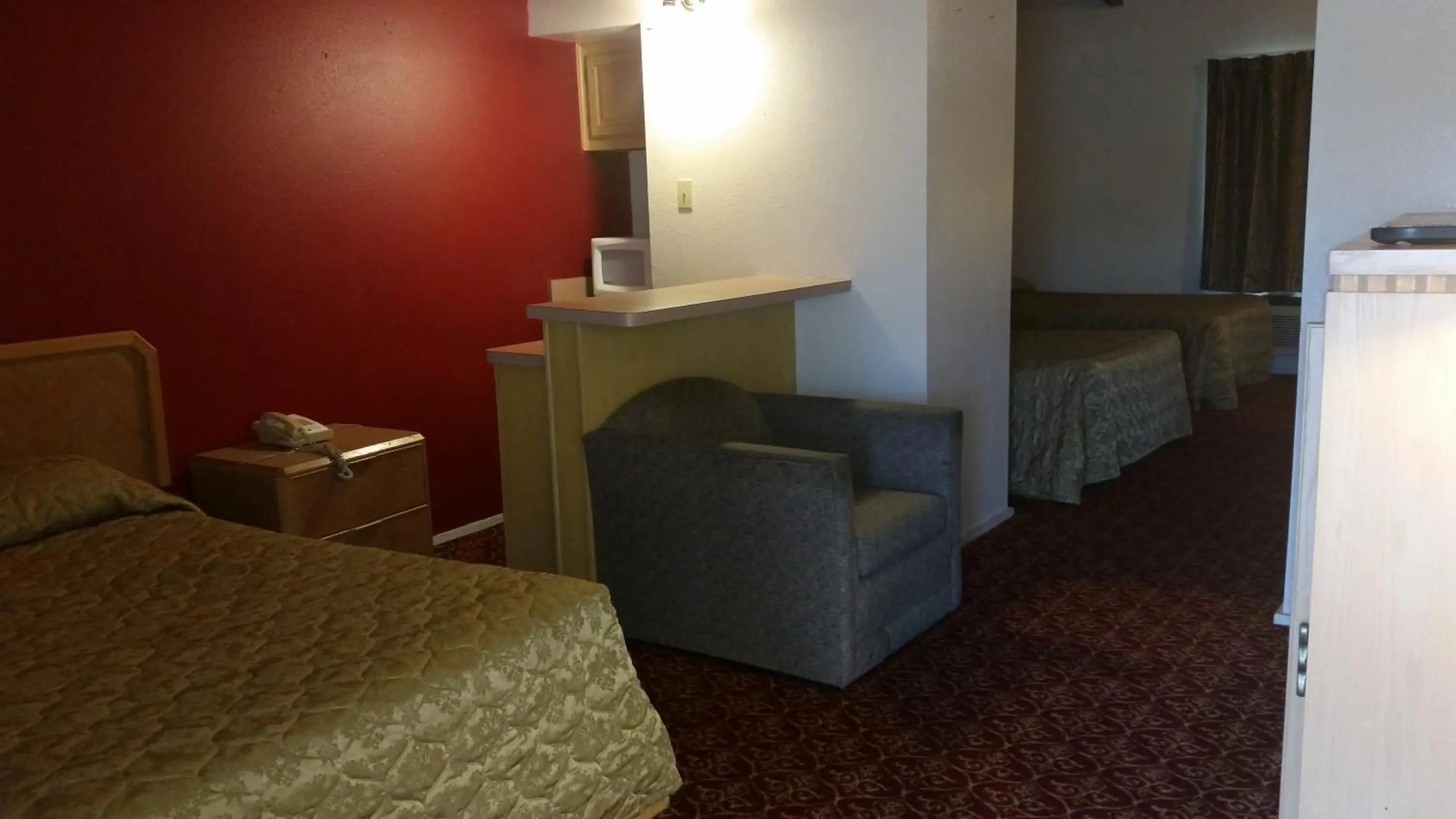Bedroom in Executive Inn and Suites Waxahachie