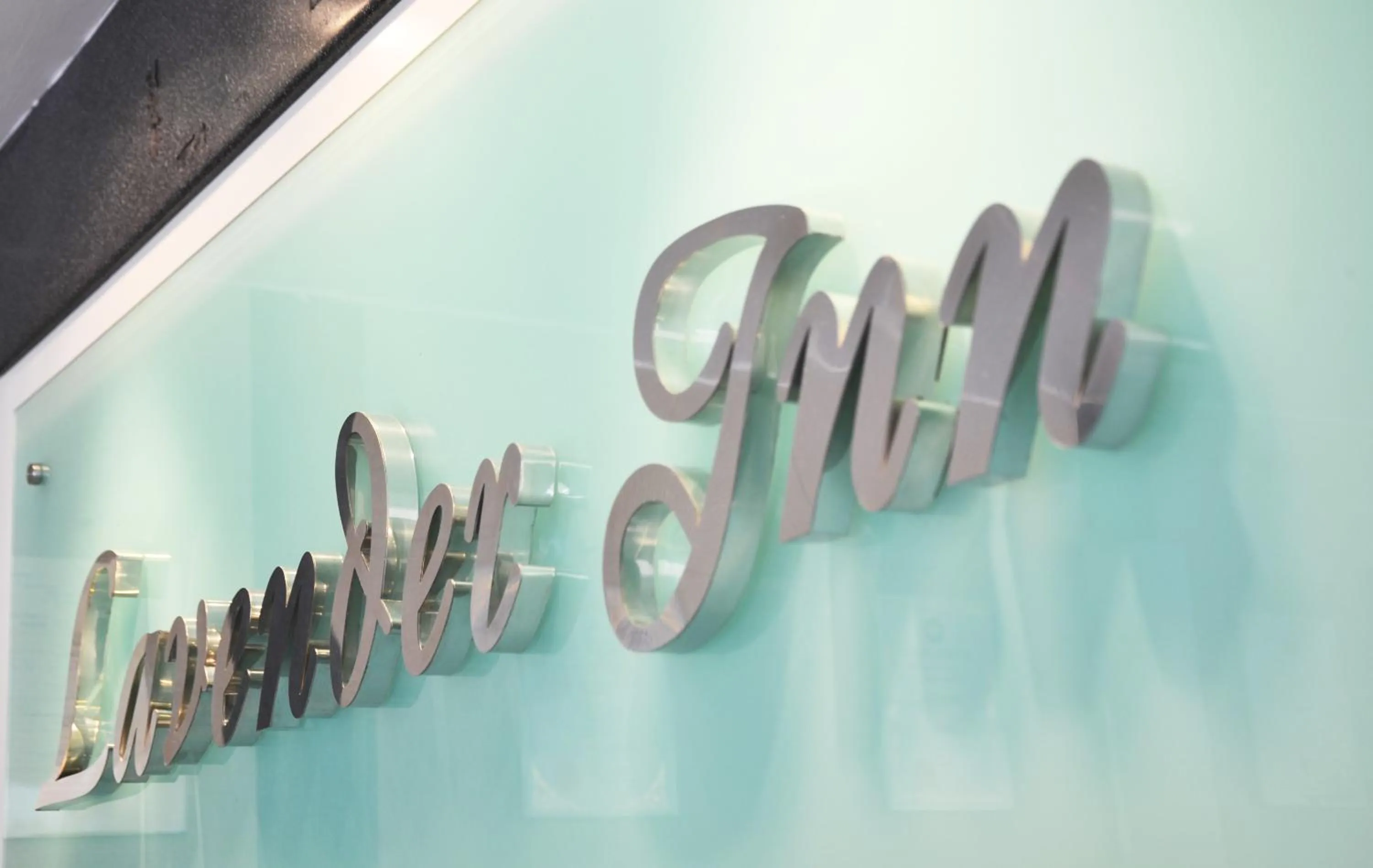 Property logo or sign in Lavender Inn Nusa Bestari