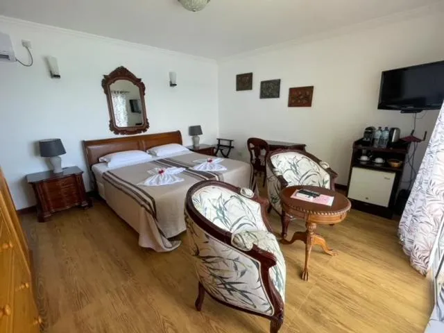 Bed in Treasure Cove Hotel & Restaurant