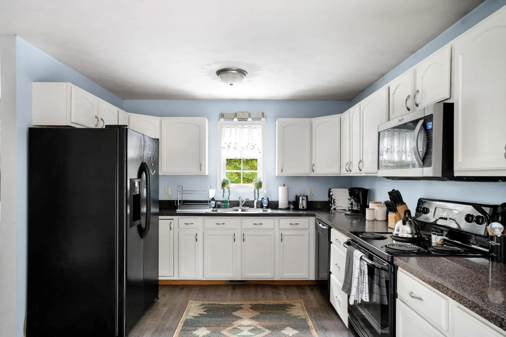 Kitchen or kitchenette in Modern decor, Hot Tub, Fire Pit & River Access!